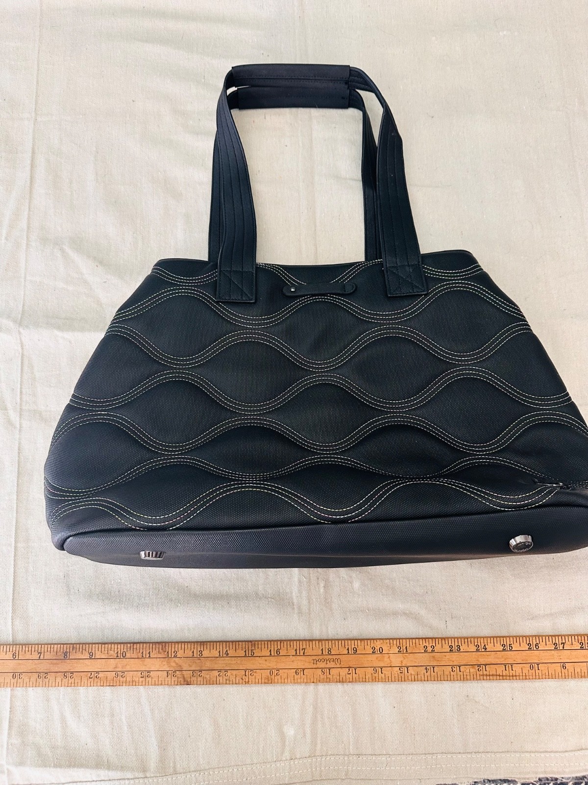 black lug handbag multicolored wavy stitching. Multi functional / very spacious