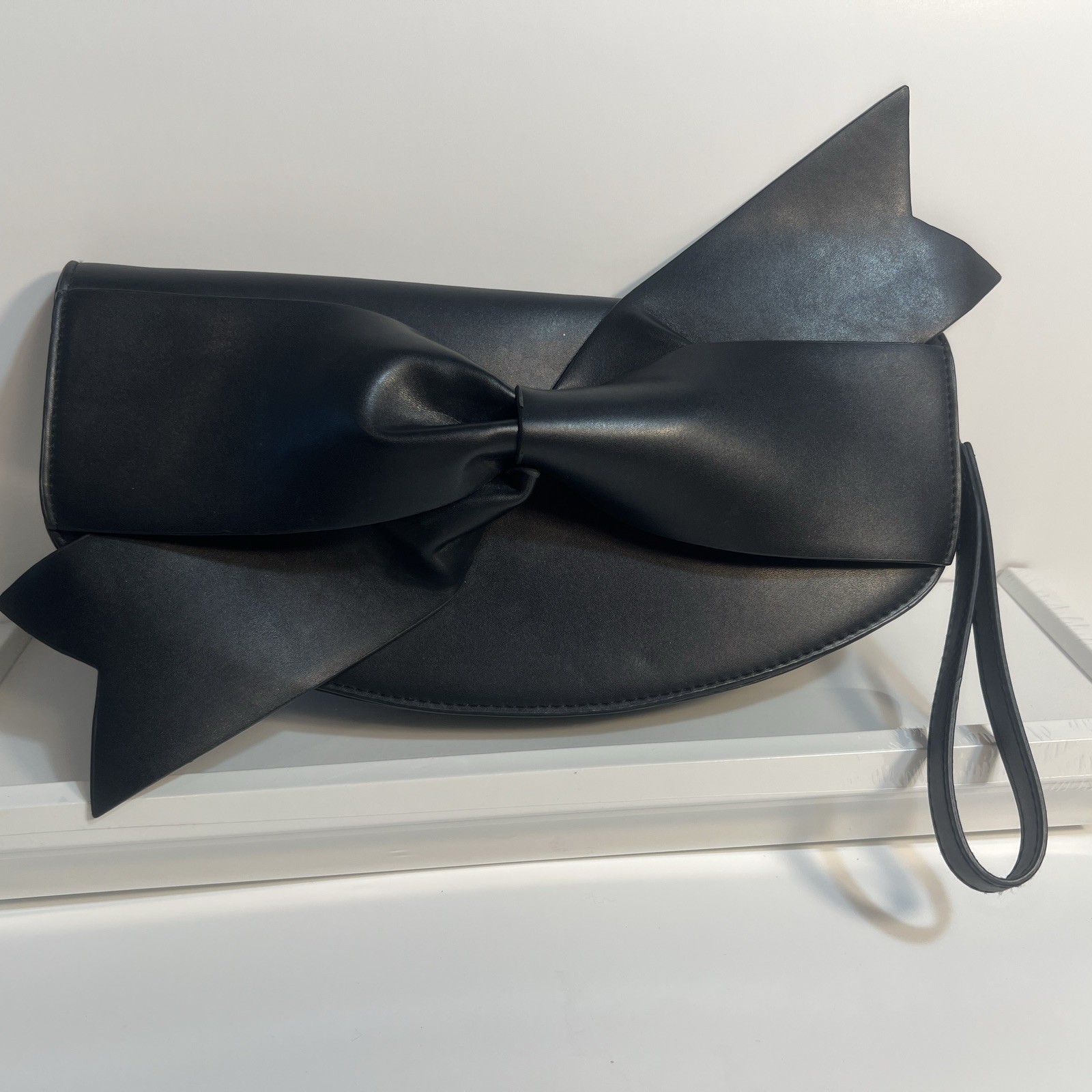 A New Day Black BOW Clutch Purse. NEW Without Tags. 11 1/2x 6 inches