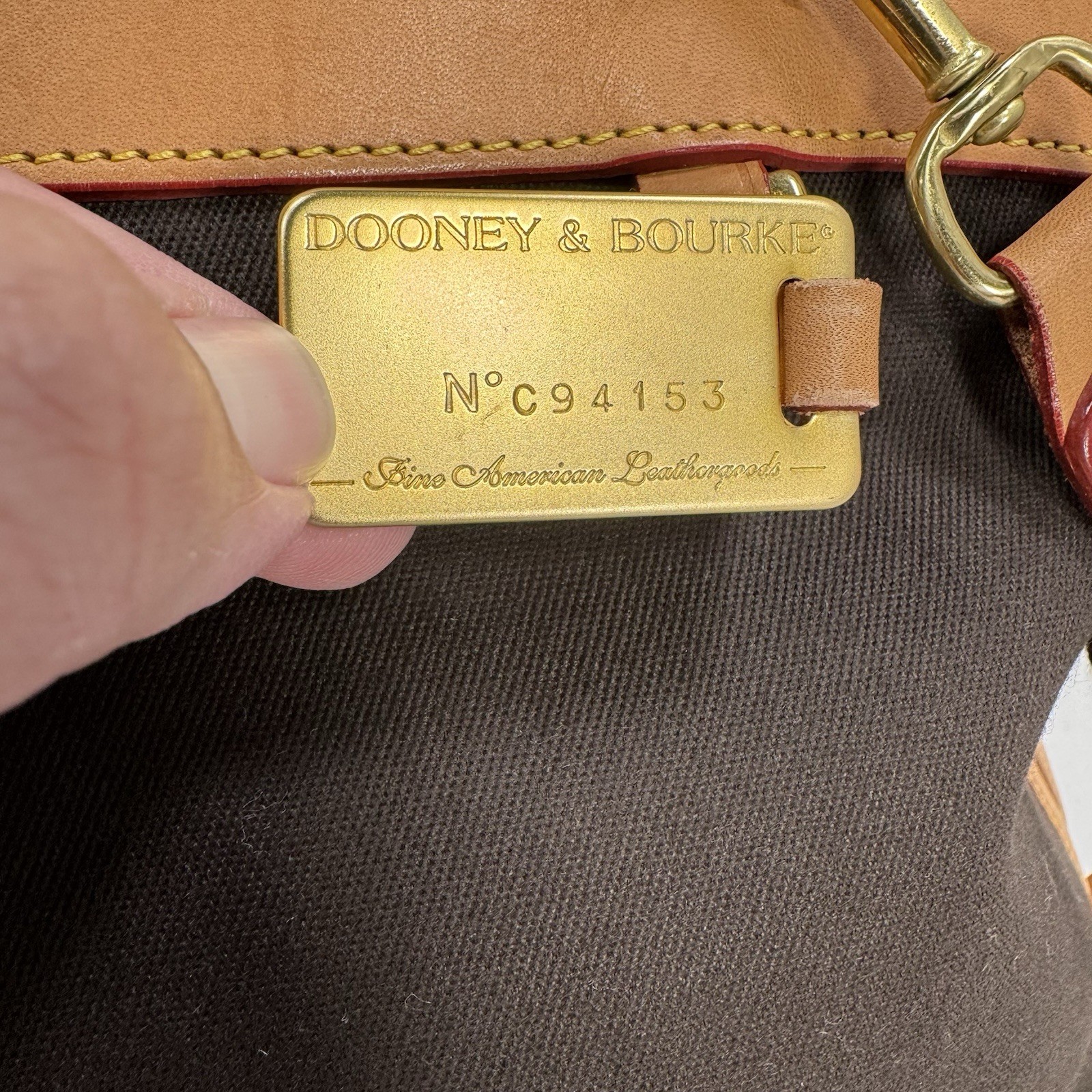 Dooney & Bourke Tan and Black Cabriolet Overnight Travel Bag – See Details