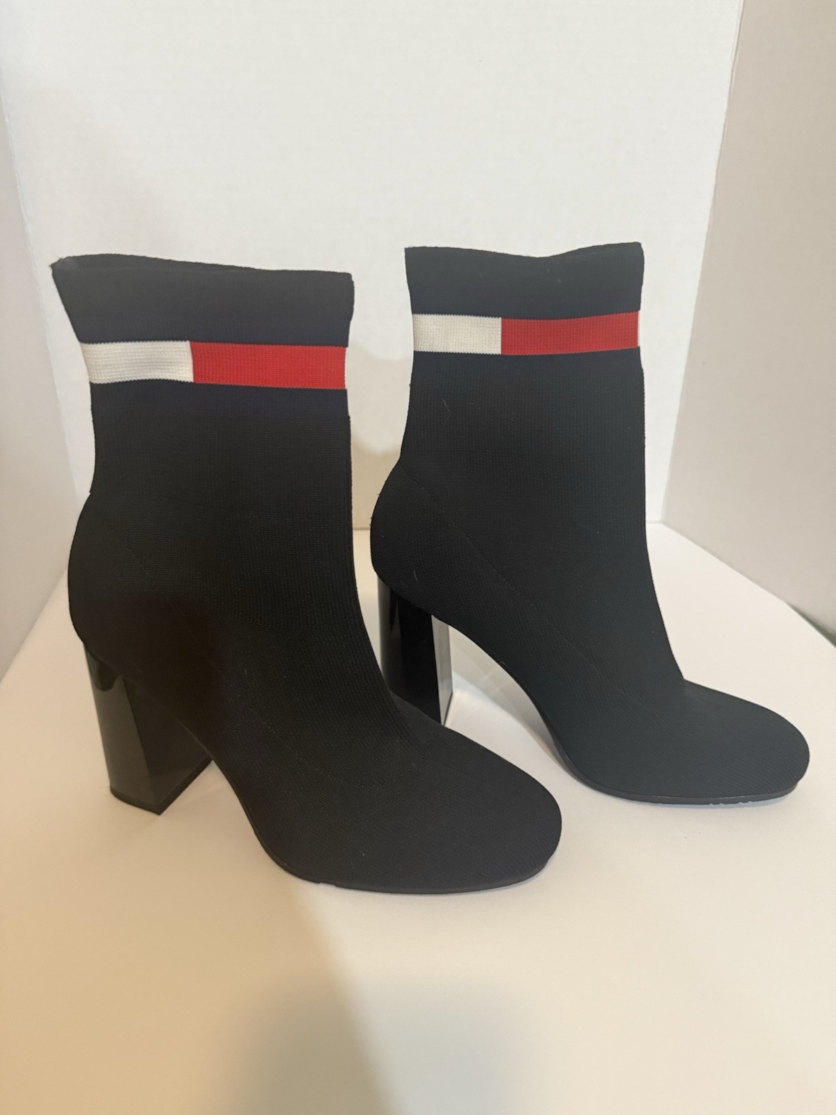 These are sock-type ankle boots with a block heel from the Tommy Hilfiger brand.