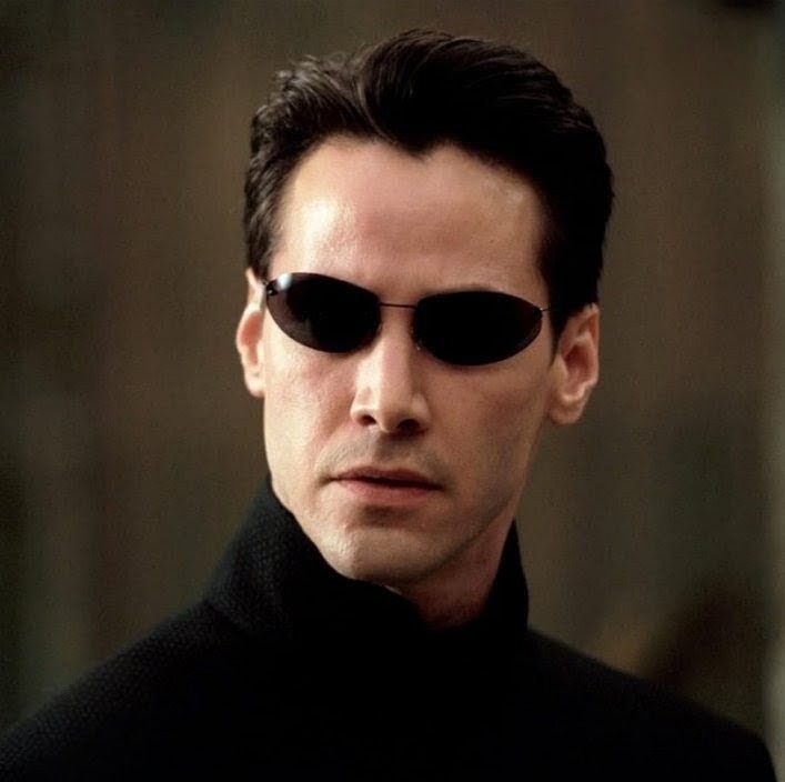 Original Matrix Movie “Neo” Sunglasses W/Black Rimless Frame And Black Lenses.