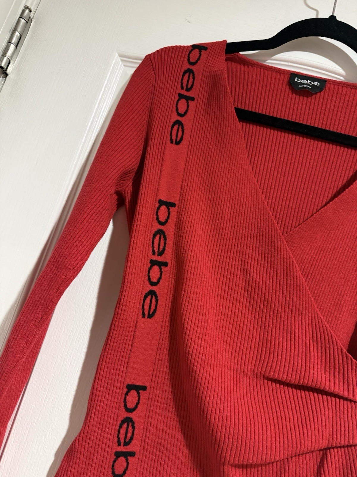 BEBE Red Asymmetric Side LOGO Faux Wrap Ribbed Knit V Neck Sweater Size Small