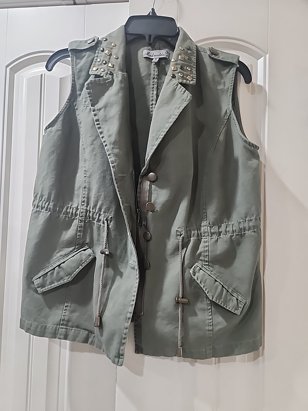 Elevate Your Style With This Sleevless Studded Jacket Size Medium.