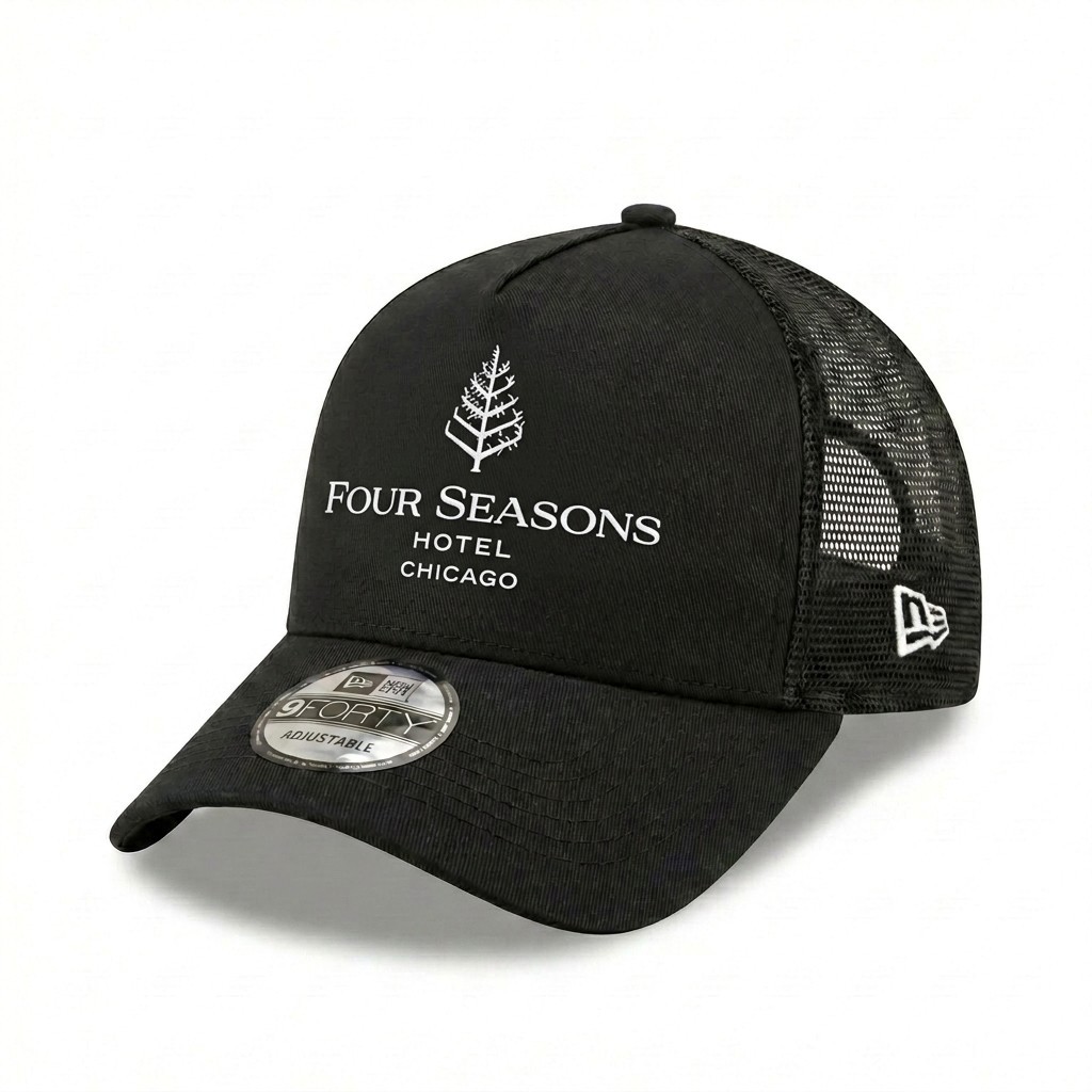 Four Seasons Hotel Embroidered 9FORTY Trucker Hat Black Mesh Snapback Cap