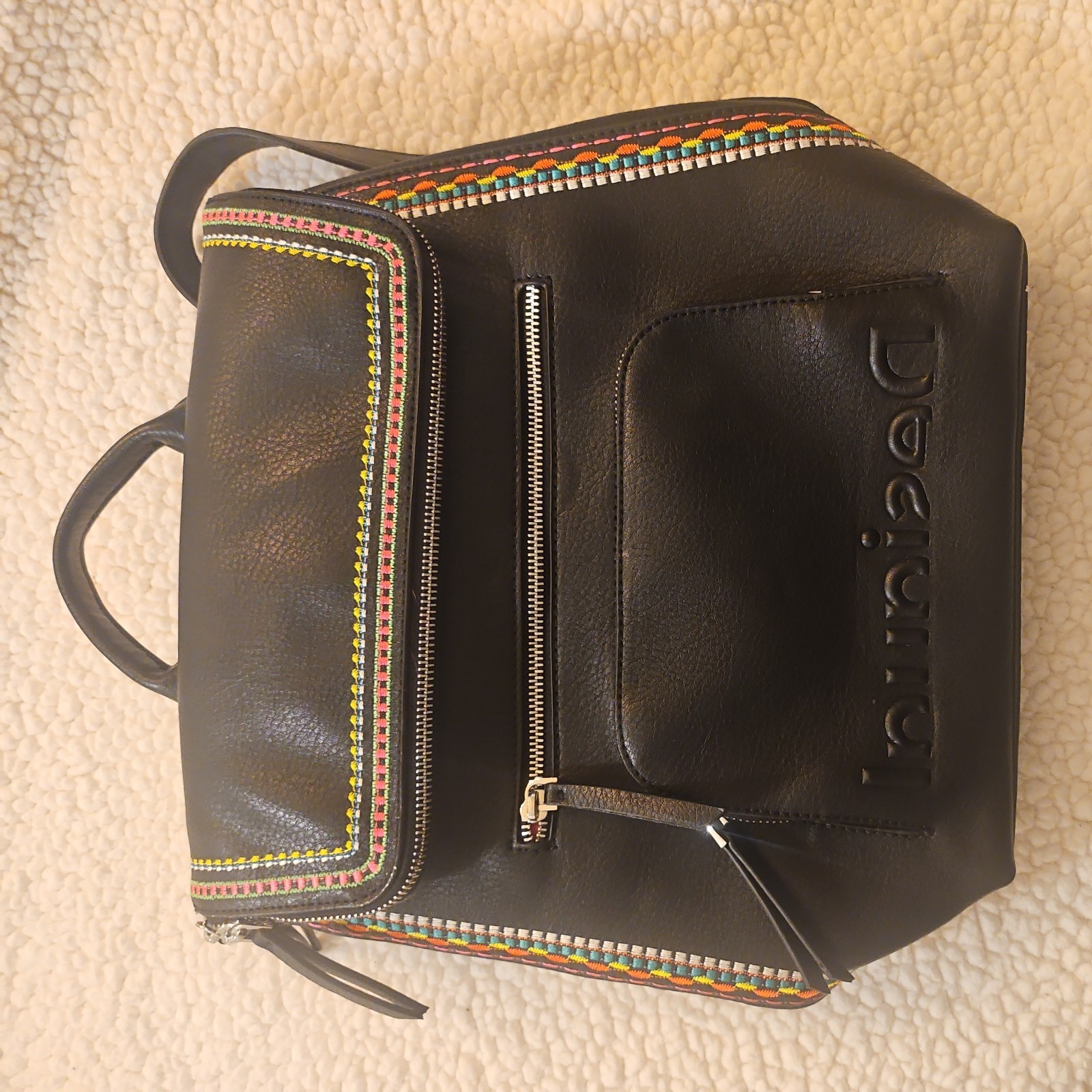 Midsize backpack,multicoloured embroidery,magnetic flap closure, zip, pockets.