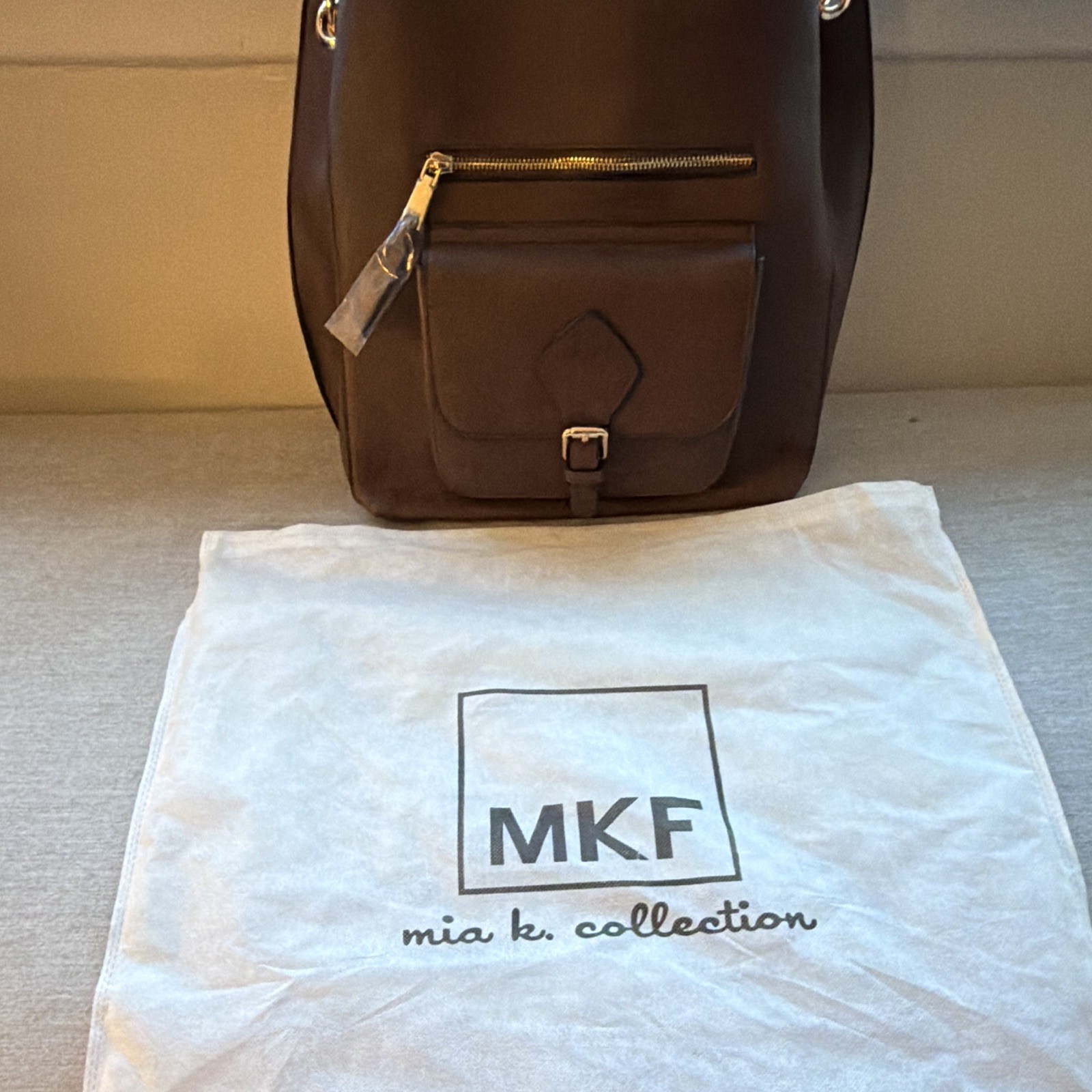 MKF Brown Medium Satchel Zip Top Handle, Detachable Strap, Charm & Dust Bag.