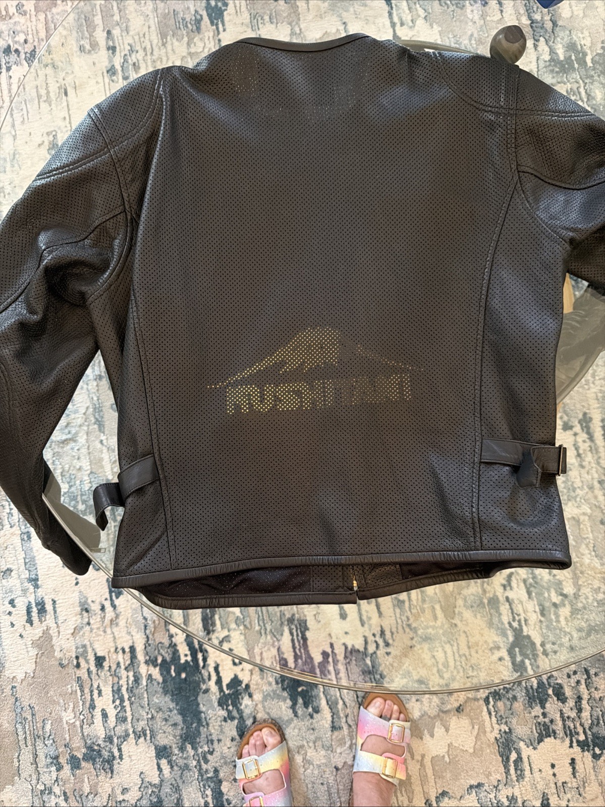 Kushitani leather biker jacket features a perforated design for airflow.