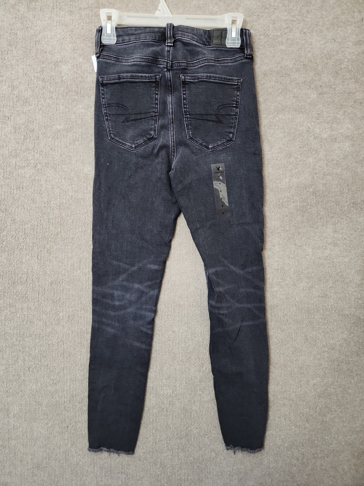 American Eagle Super Stretch Jegging Jeans Womens 4 Black Wash Raw Hem NWOT