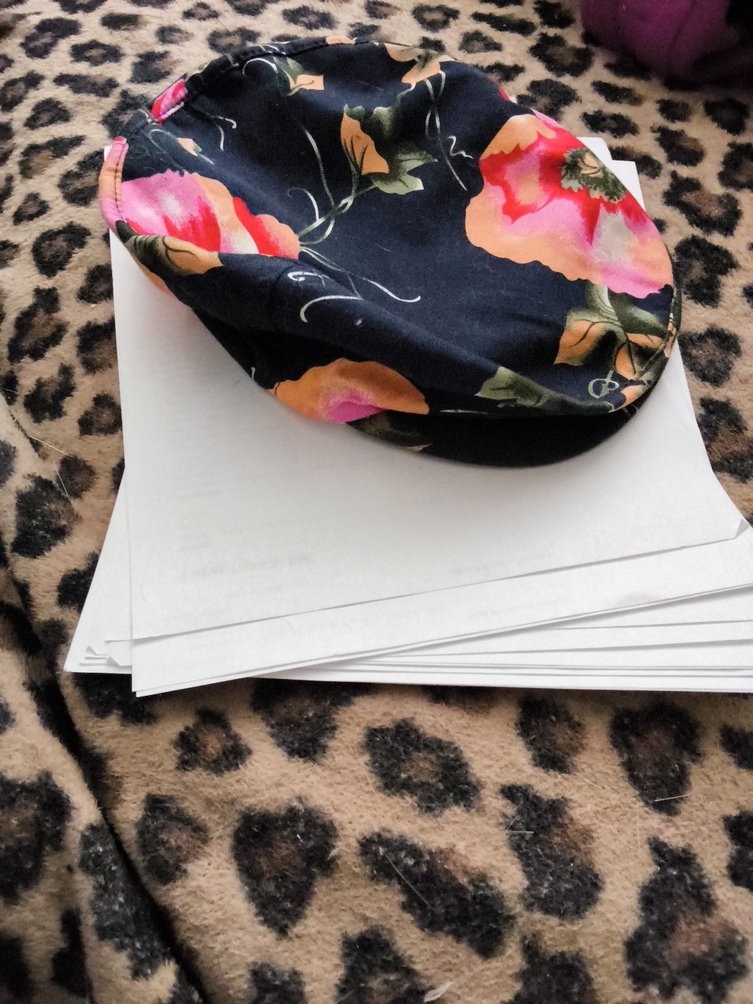 Based on the image provided, this item is a floral print cap, featuring large…