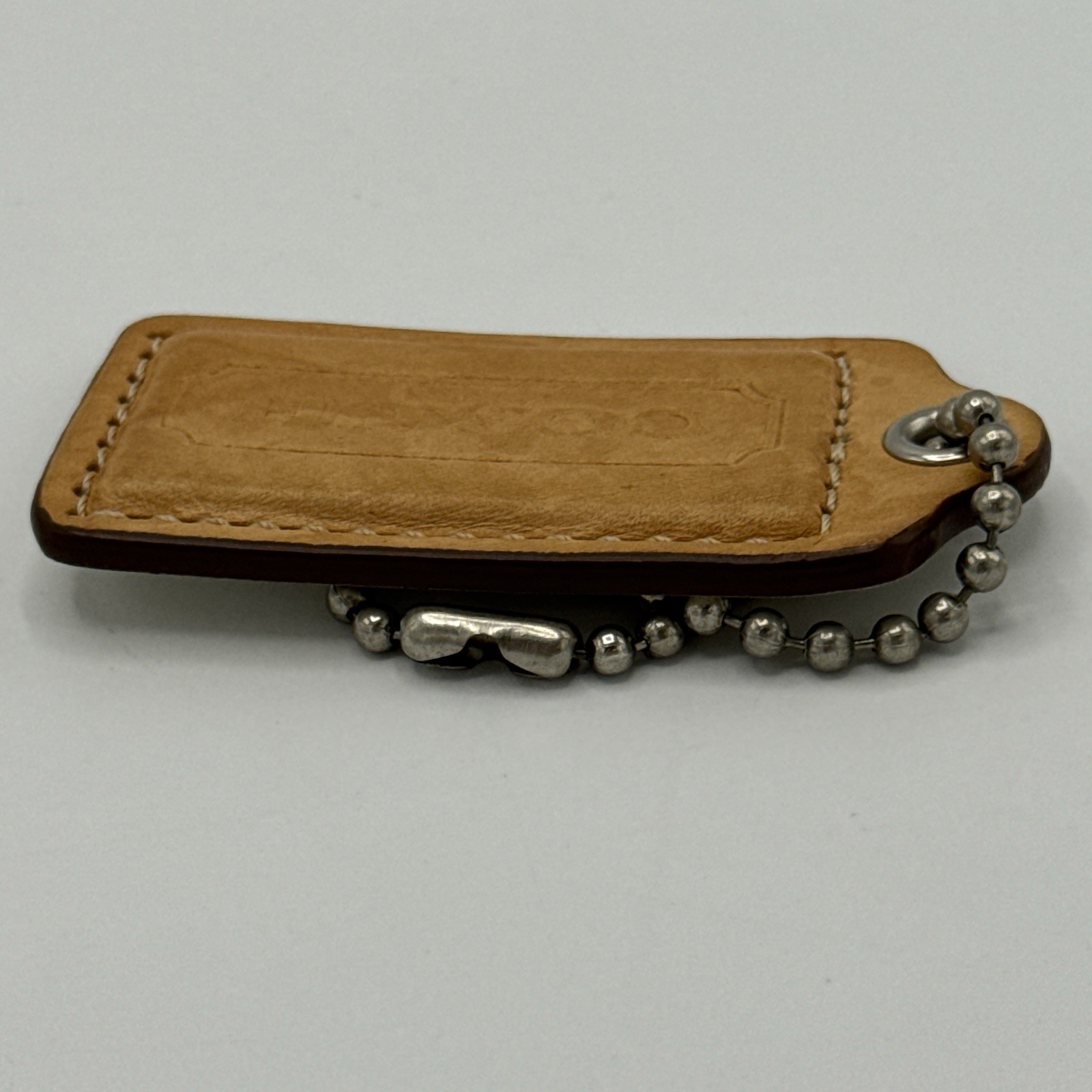 Coach Hang Tag Light Brown Leather Colored 2 & 1/2 Inches Wide / Silver Tone