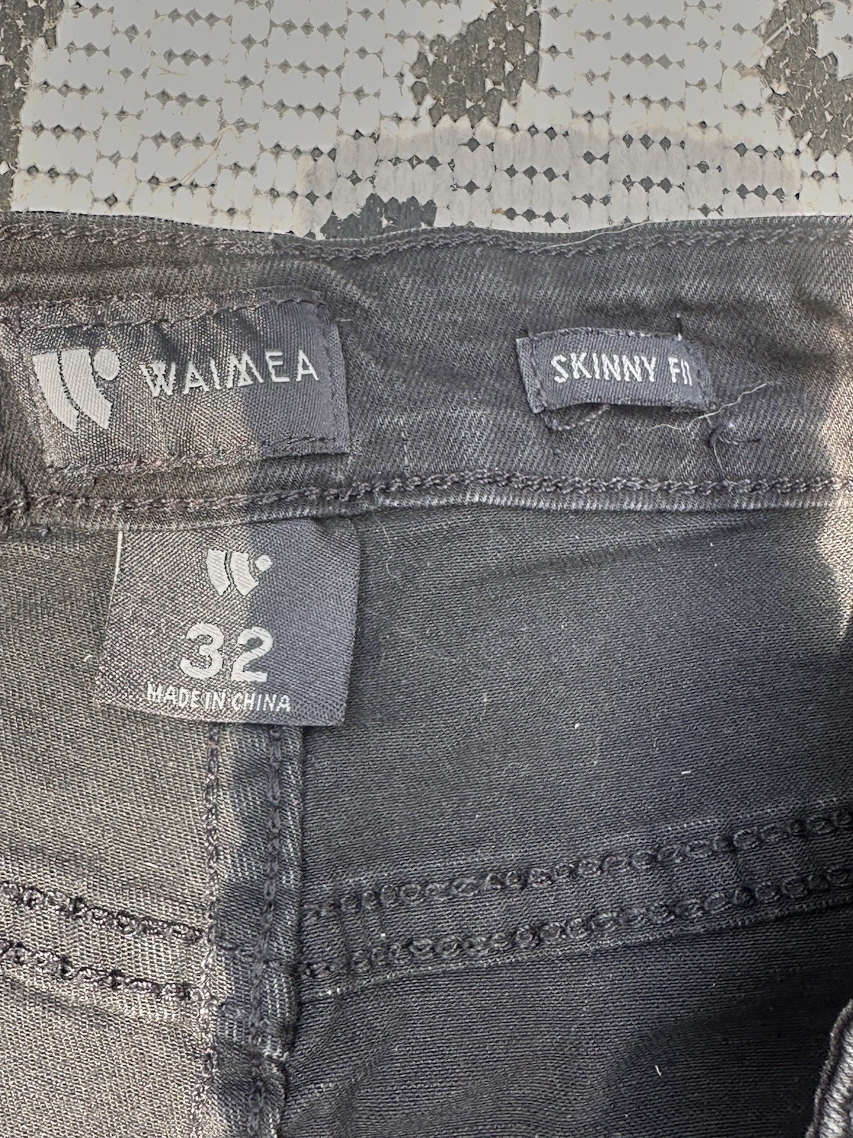 Waimea black skinny jeans with rhinestone skull. Size 32