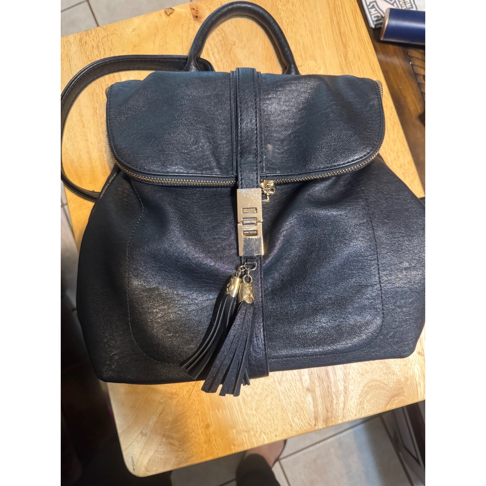 Mystique Black Vegan Leather Tassel Backpack Gold Hardware Striped Lining
