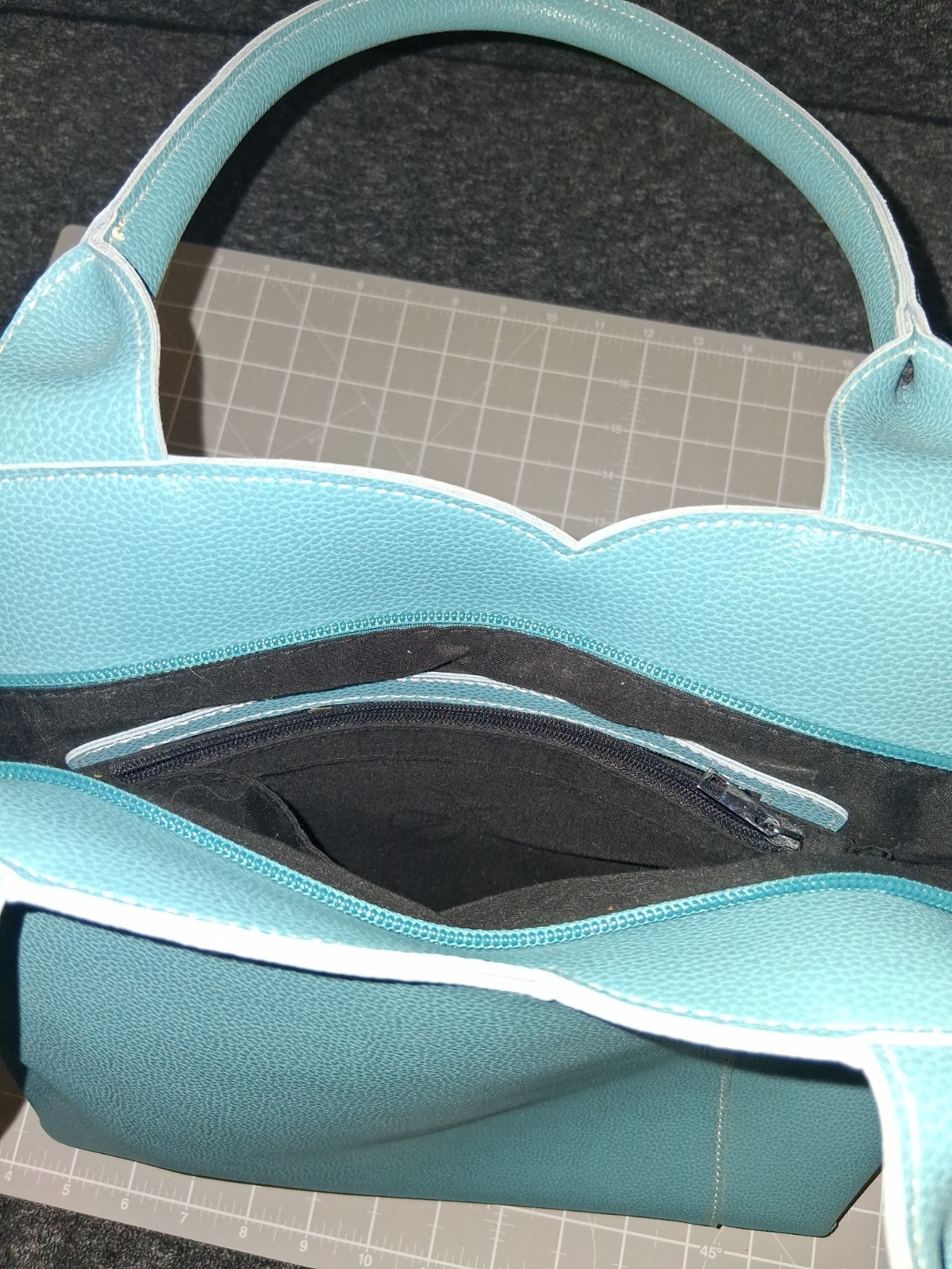 Mellow World tote grained vegan leather tulip curved front panel vibrant teal