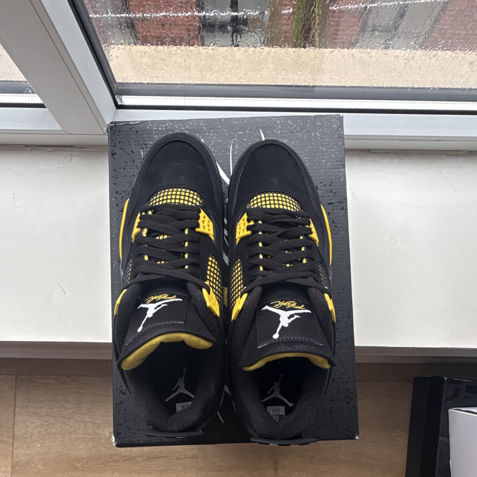 Jordan Air Jordan 4 Retro Thunder Mid Top Sneaker Black/Tour Yellow 2023