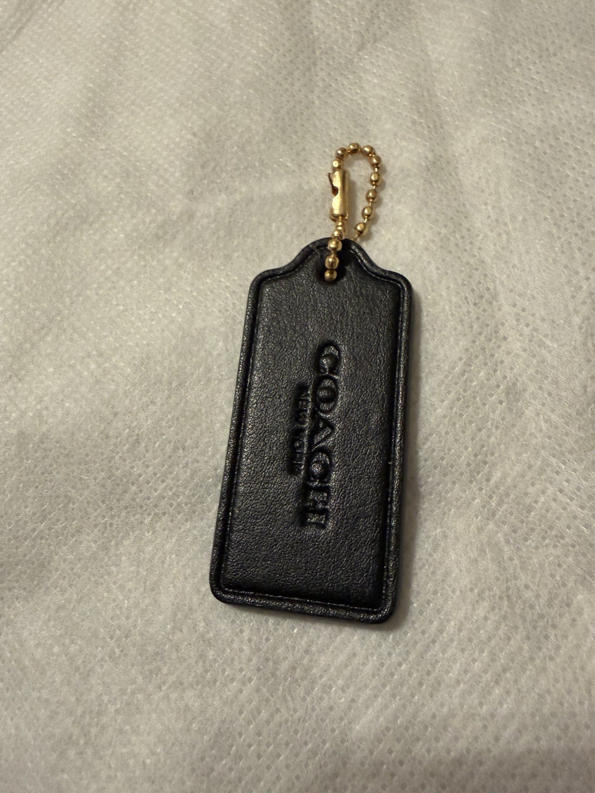 Coach Hang Tag