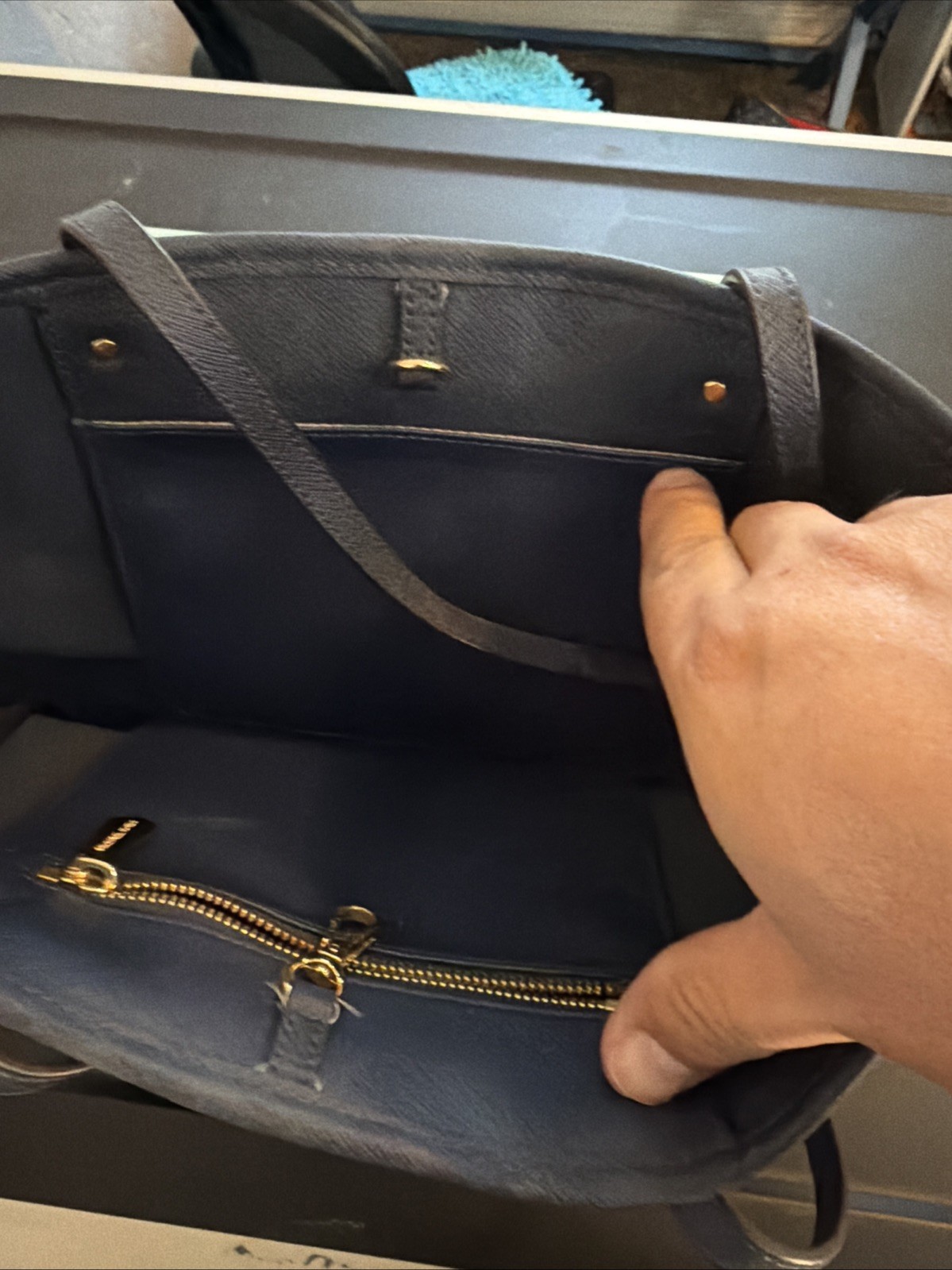 Michael Kors tote features gold-toned hardware distinctive front buckle strap