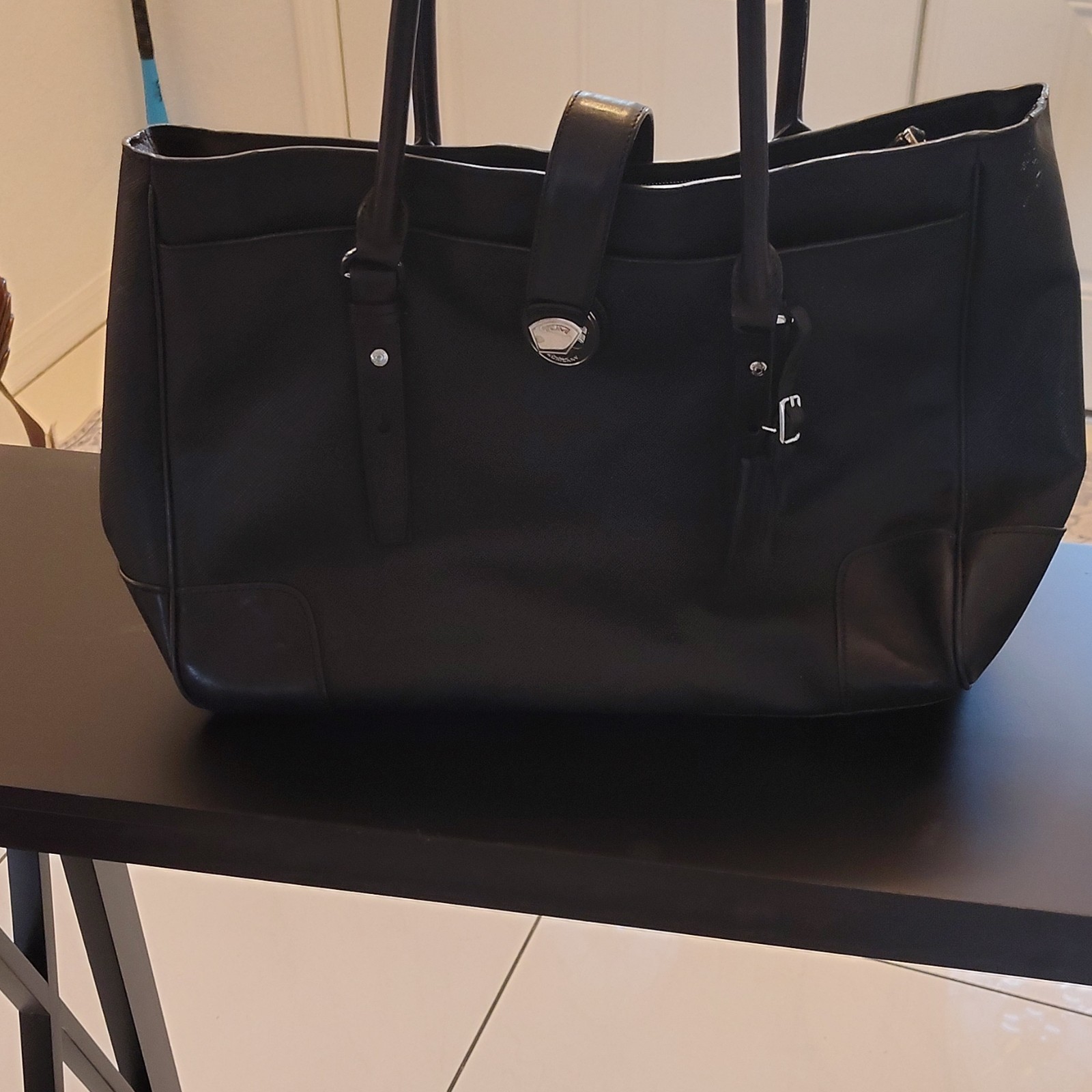 Tumi Black Buckle Accent Women’s Tote with Inner Pockets & Bottom Studs
