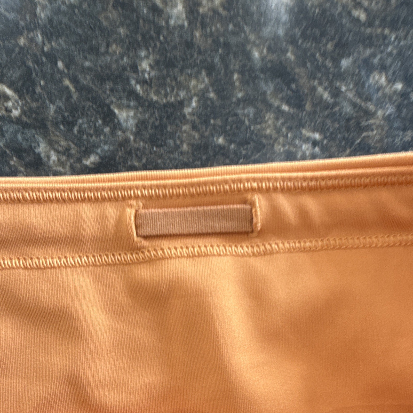 Athleta Women’s Run With It Orange 3.5in Running Shorts Zip Pockets Stretch