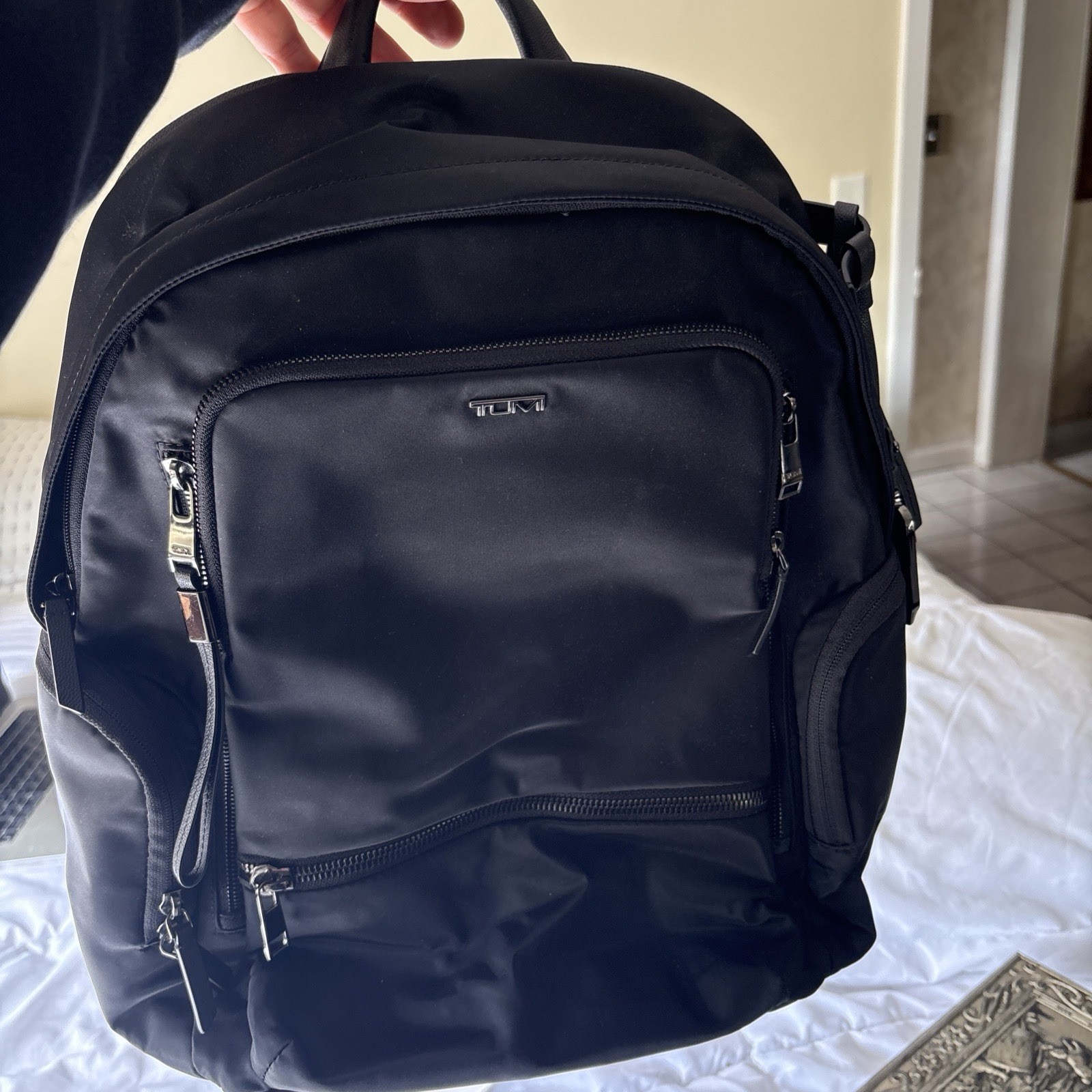 TUMI Black Backpack, Zip Closure, Adjustable Straps, Pockets, Top Handle