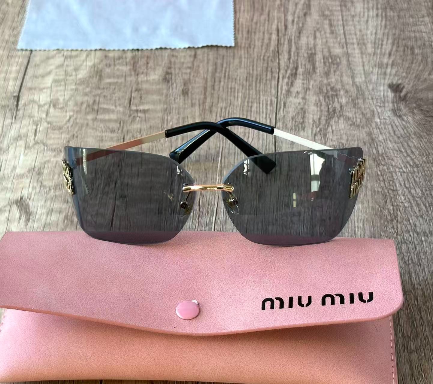 MIU MIU SUNGLASSES BLACK GRAY 100% AUTHENTIC WITH ORIGINAL PACKAGE SHIELD