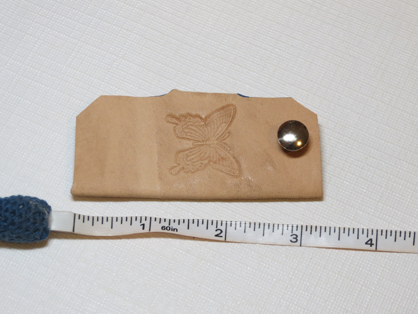 Handmade leather key holder light tan with butterfly 3.25″ X 1.5″ color varies