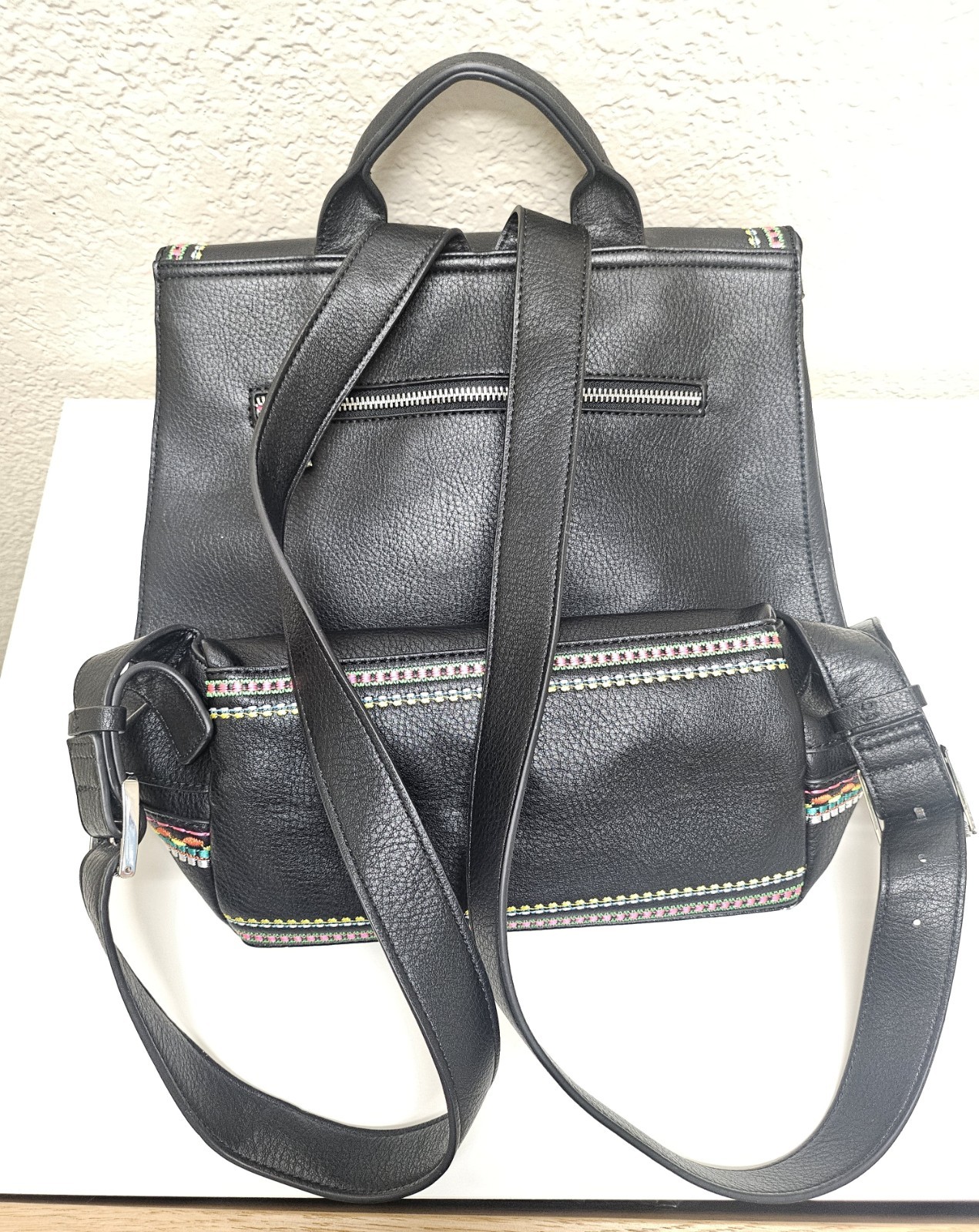 Midsize backpack,multicoloured embroidery,magnetic flap closure, zip, pockets.