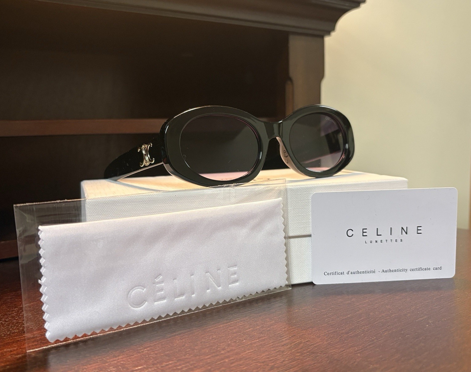 CELINE Women’s Logo Oval Sunglasses Black Frame/Black Tinted Lenses
