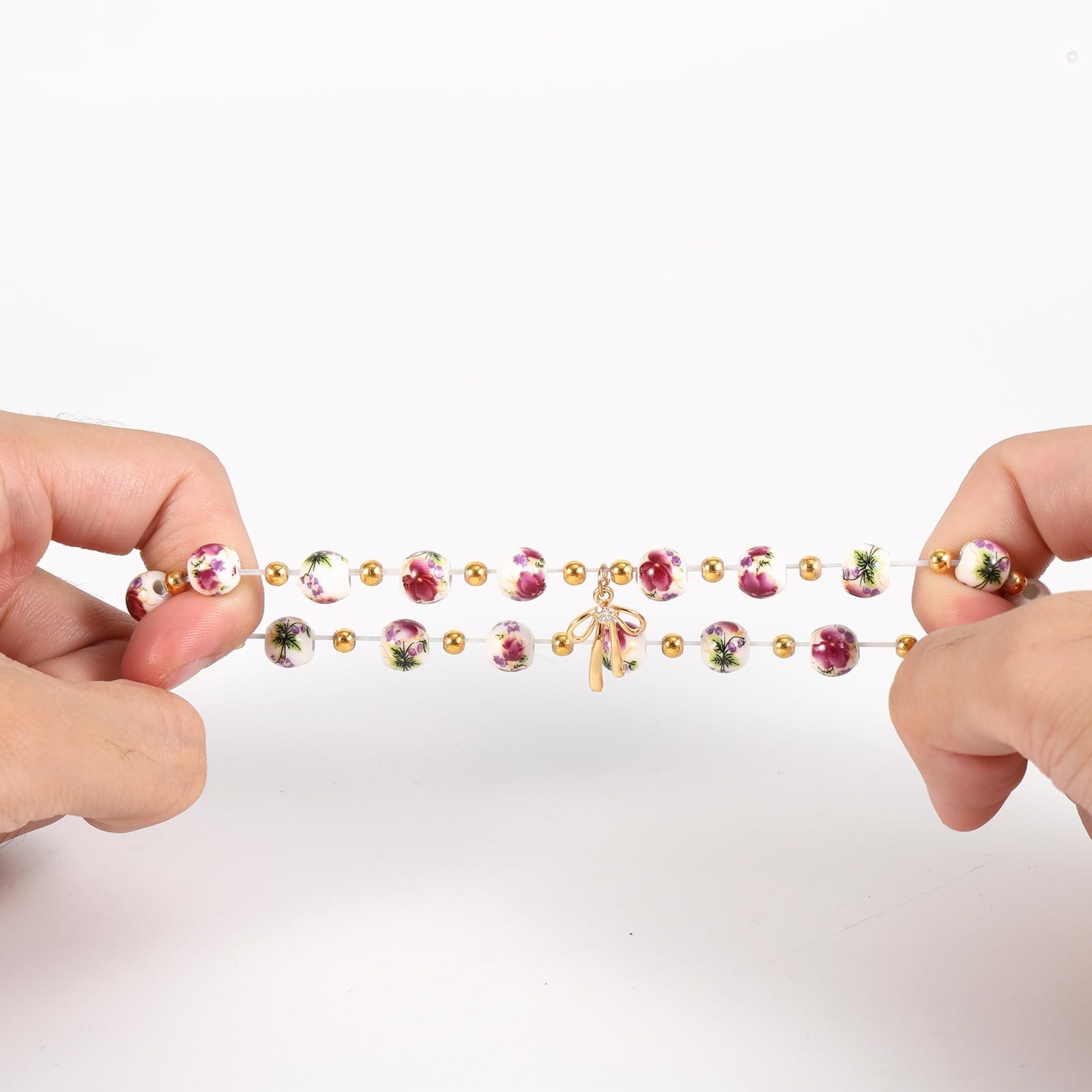 Mikovivi Beads Bow Charm Bracelet Medium, as shown in the detailed picture