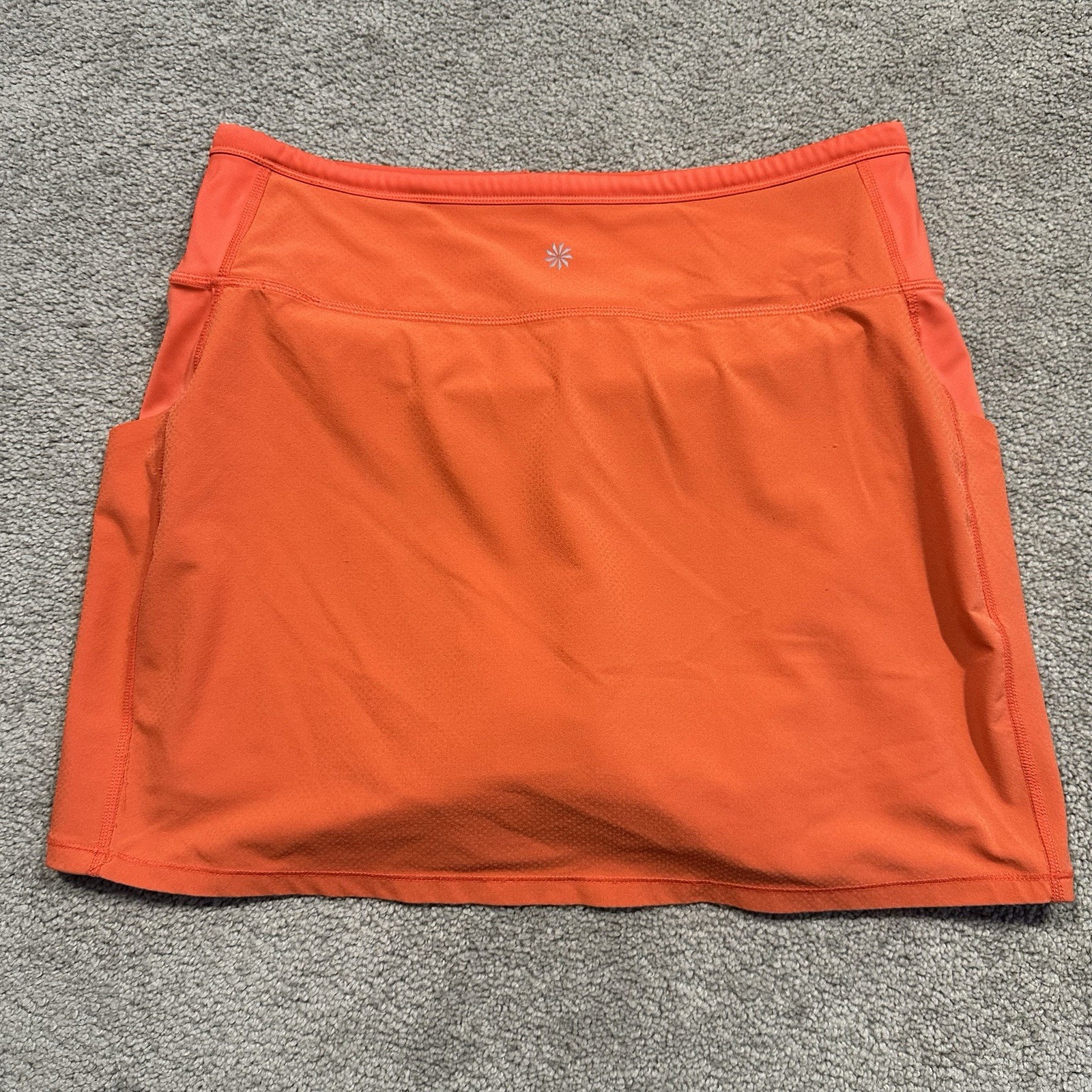 ATHLETA Action Skort in Dobby 14.5 Womens Small Orange Pockets Stretch Athletic