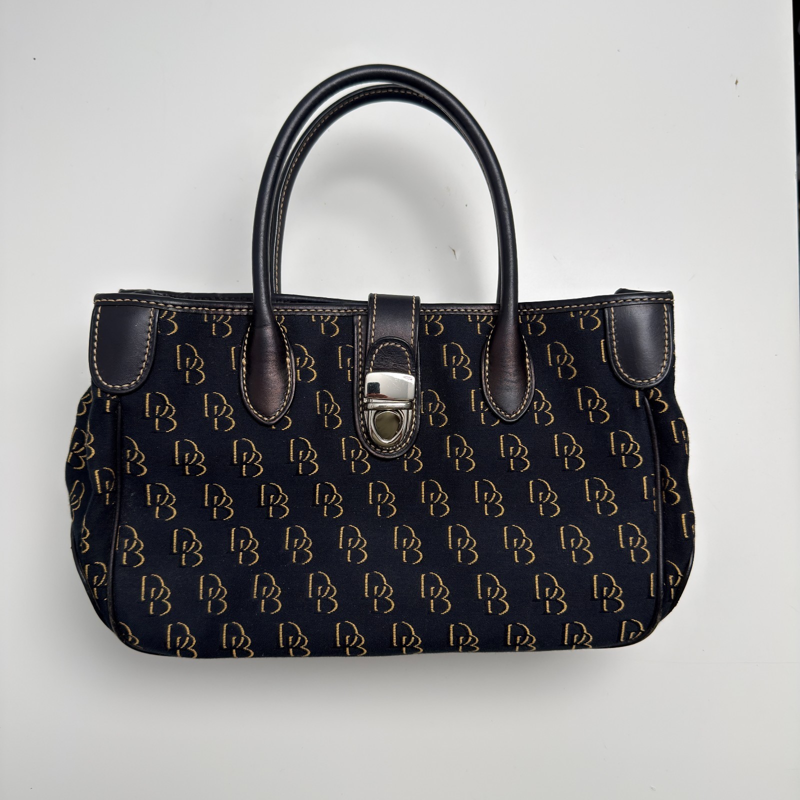 Dooney & Bourke DB Monogram Satchel Purse Black Gold Leather Trim Push Lock