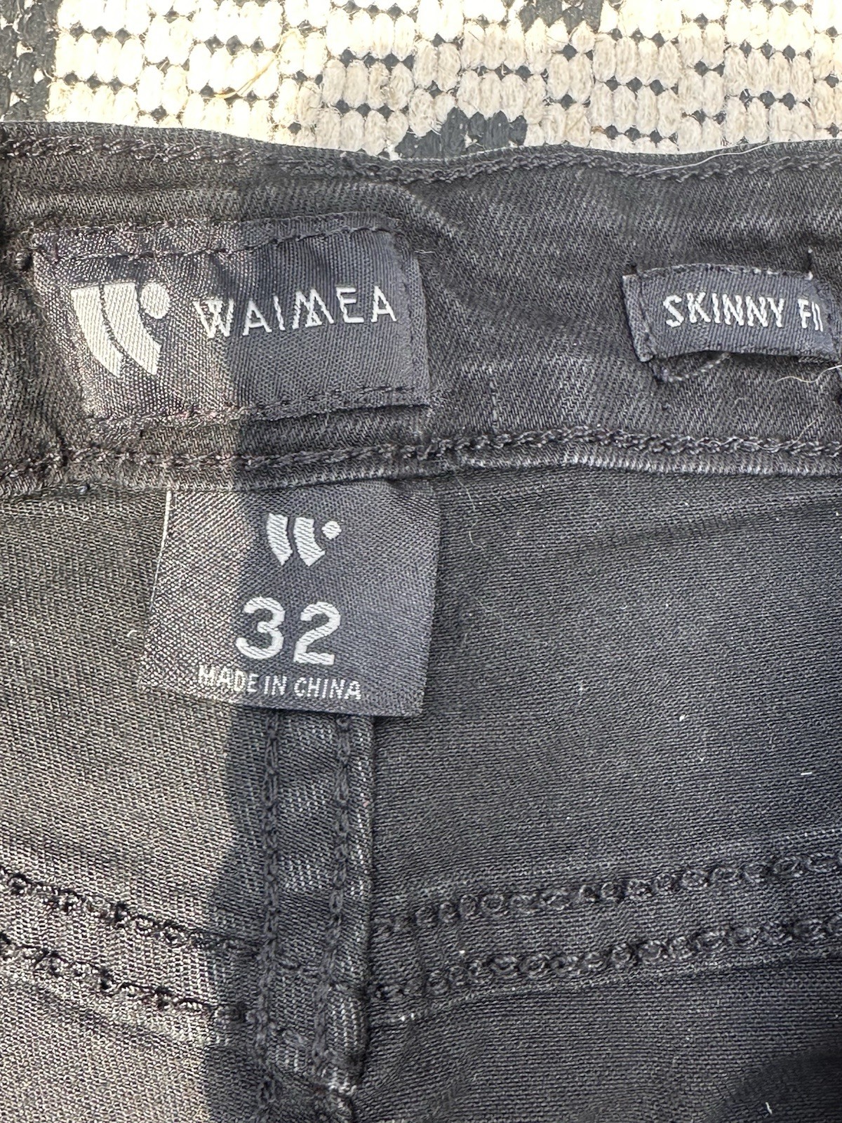 Waimea black skinny jeans with rhinestone skull. Size 32