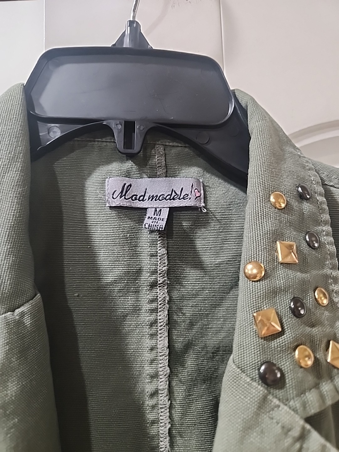 Elevate Your Style With This Sleevless Studded Jacket Size Medium.