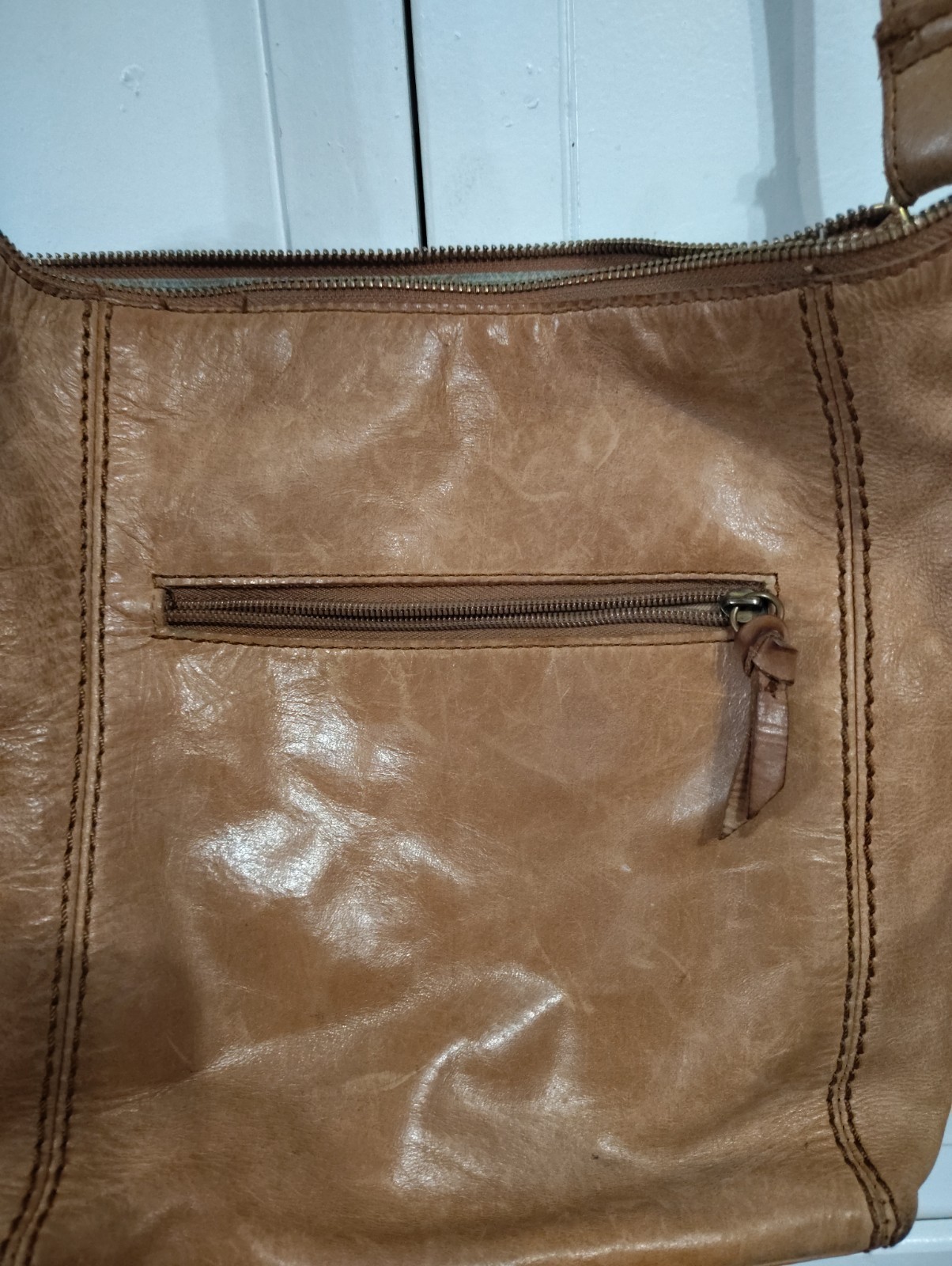 The Sak Ashland Embossed Leather Crossbody Bag Tobacco Floral Emboss