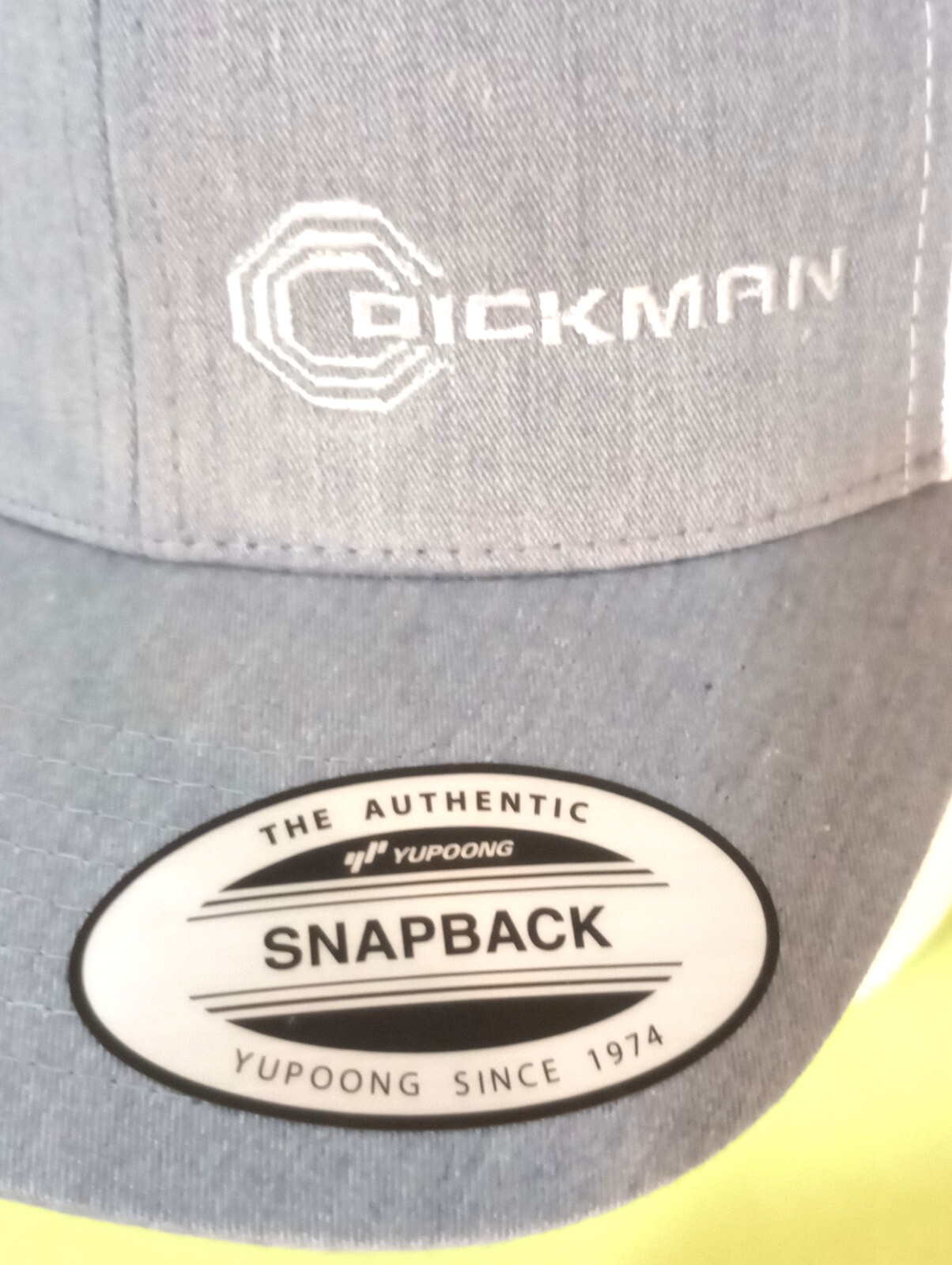 DICKMAN Logo on Yupoong 6006 Classic Trucker Hat Snapback Heather/White