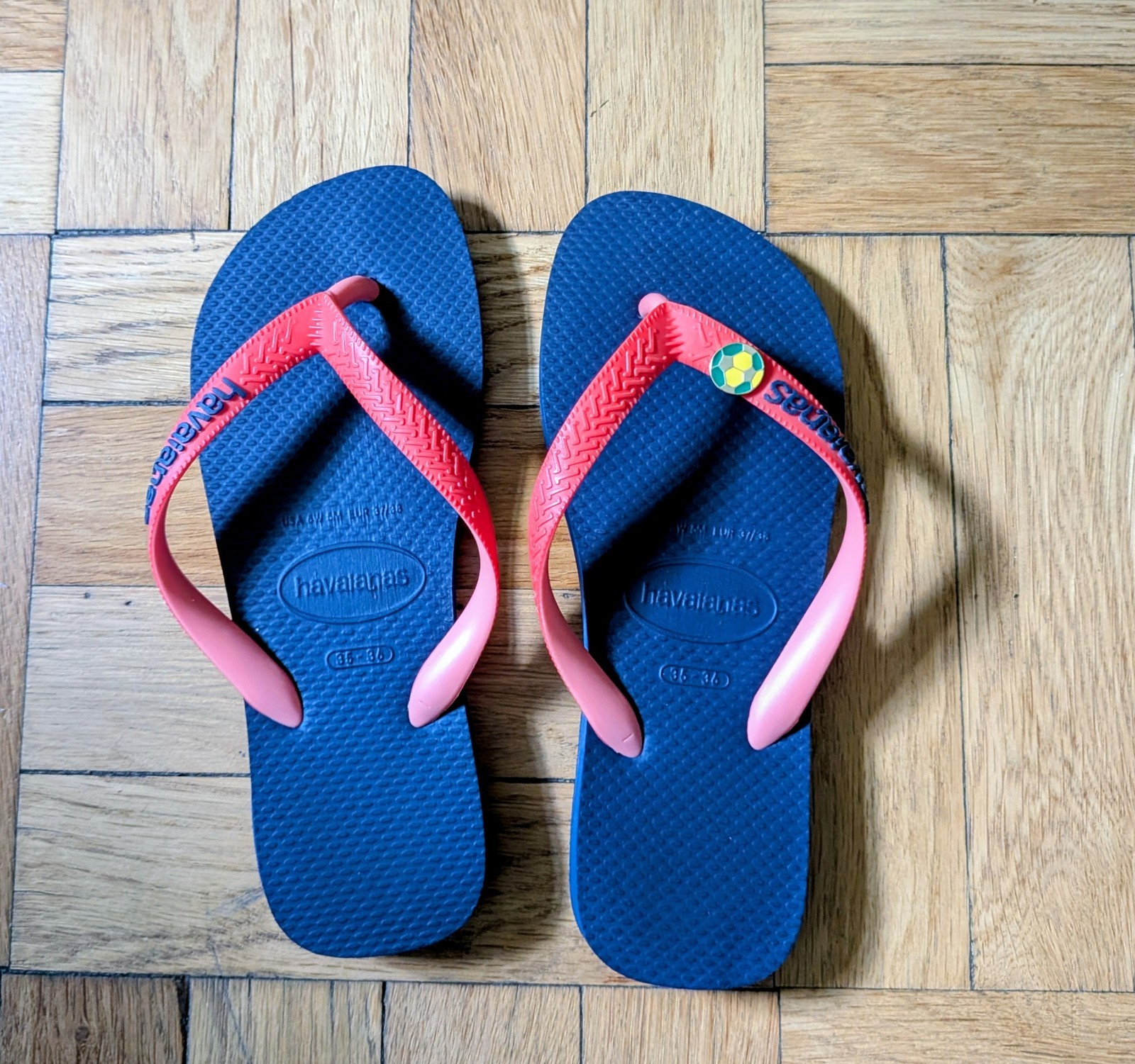 Havaianas Blue and red flip flap with soccer pin. size 6.