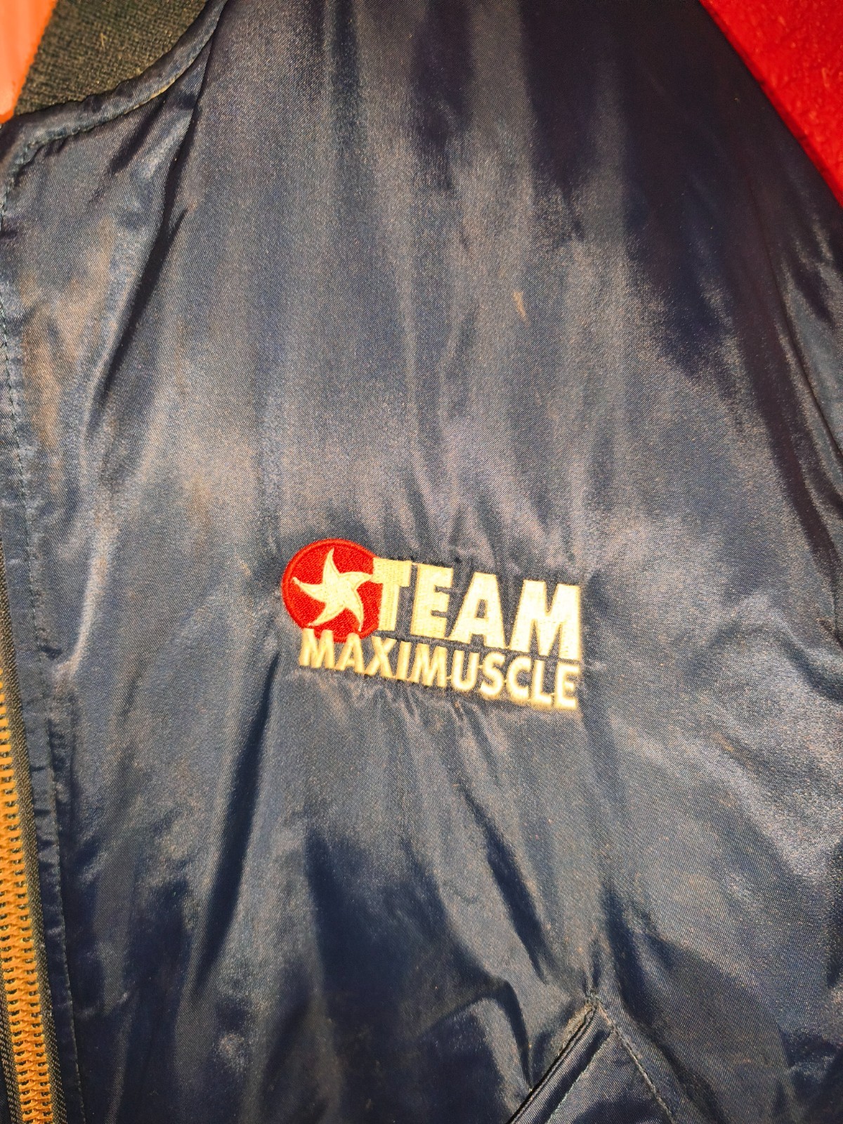 Classic 90s/Y2K bomber jacket featuring bold “Team Maximuscle” chest & back embr