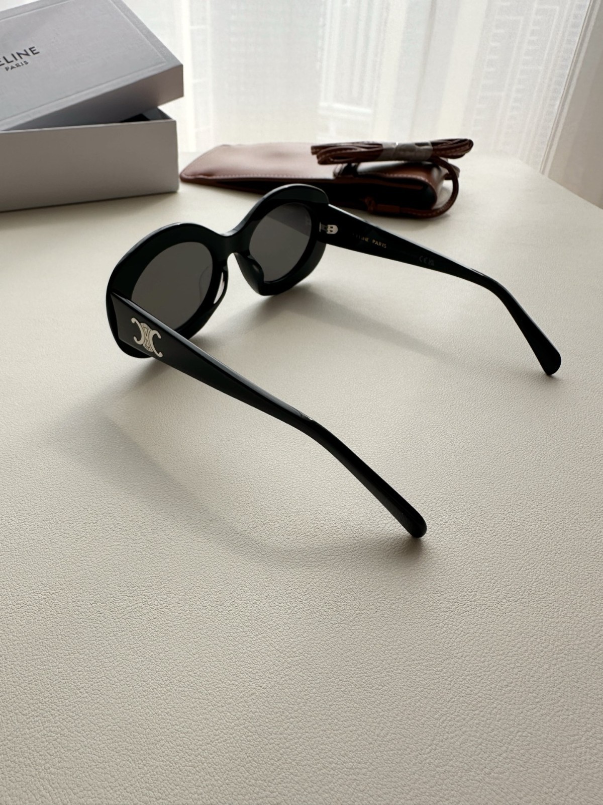 CELINE Iconic Triomphe Oval Sunglasses Black Frame Gold Logo Detail
