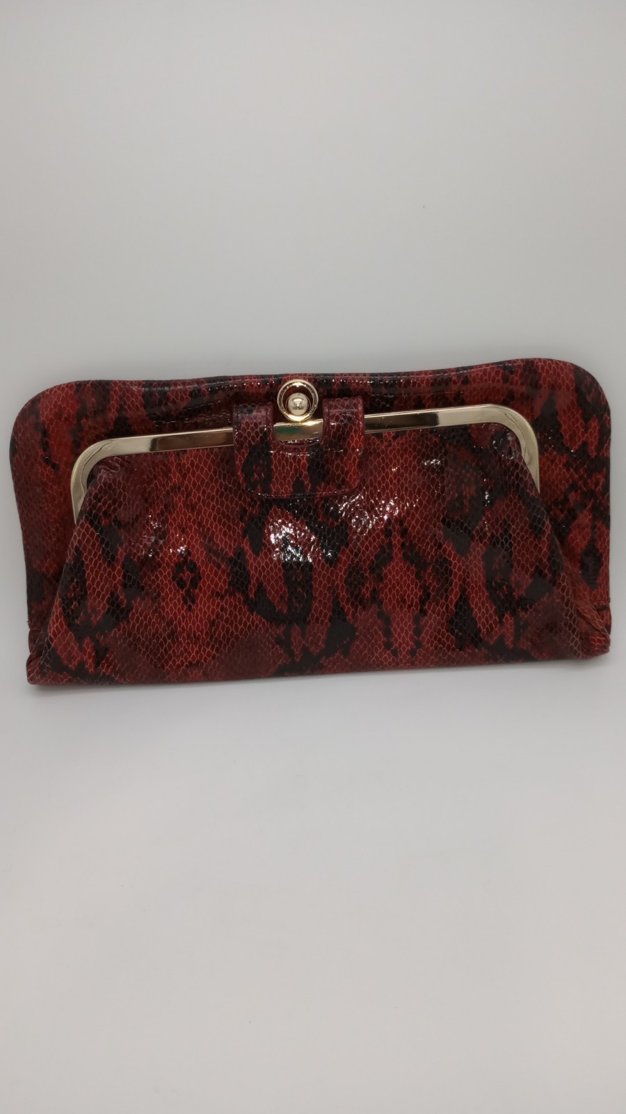Elevate your style with this stunning Kate Landry Red Leather Clutch Purse.
