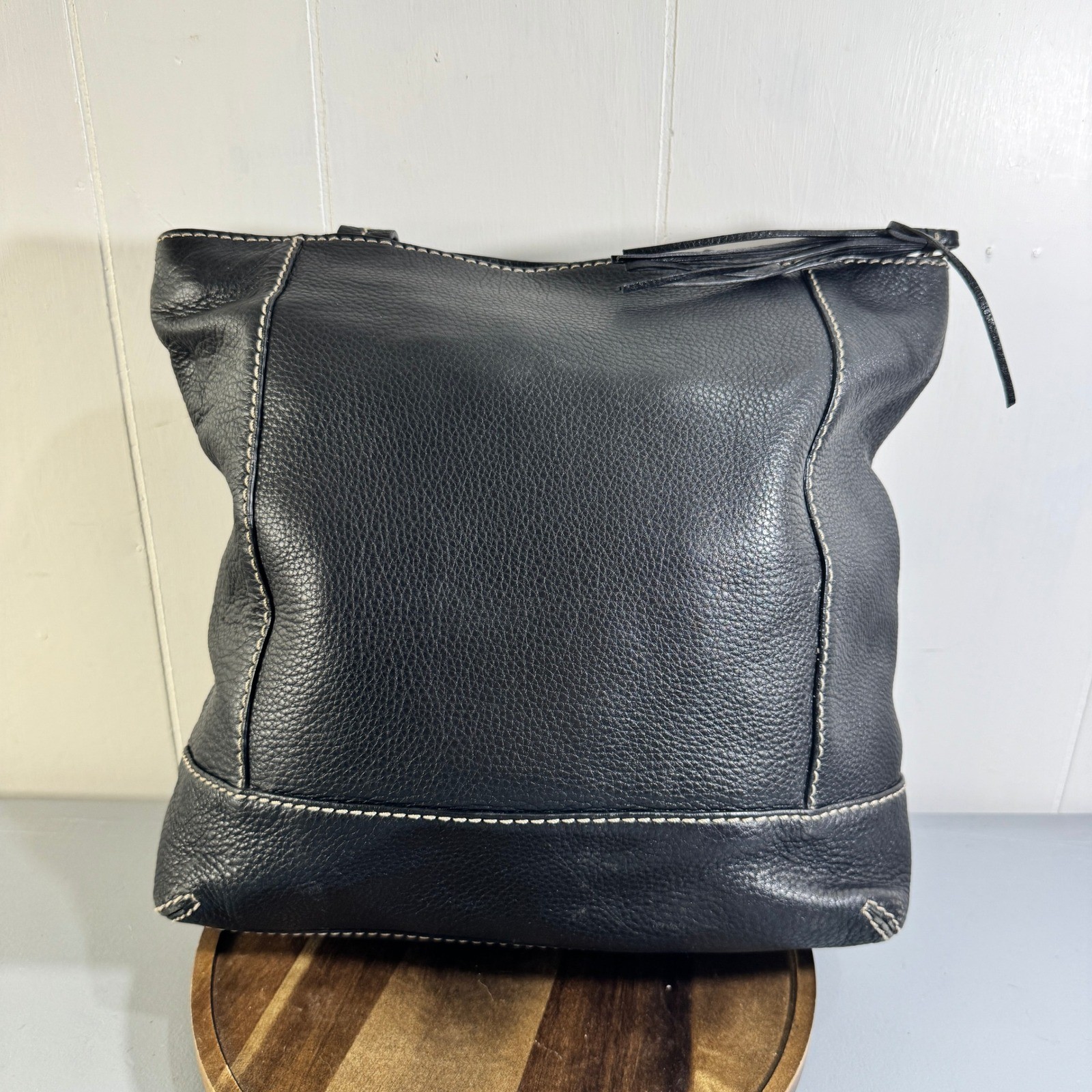 The Sak Black Leather Tote Bag With White Stitching And Tassel Accent Timeless