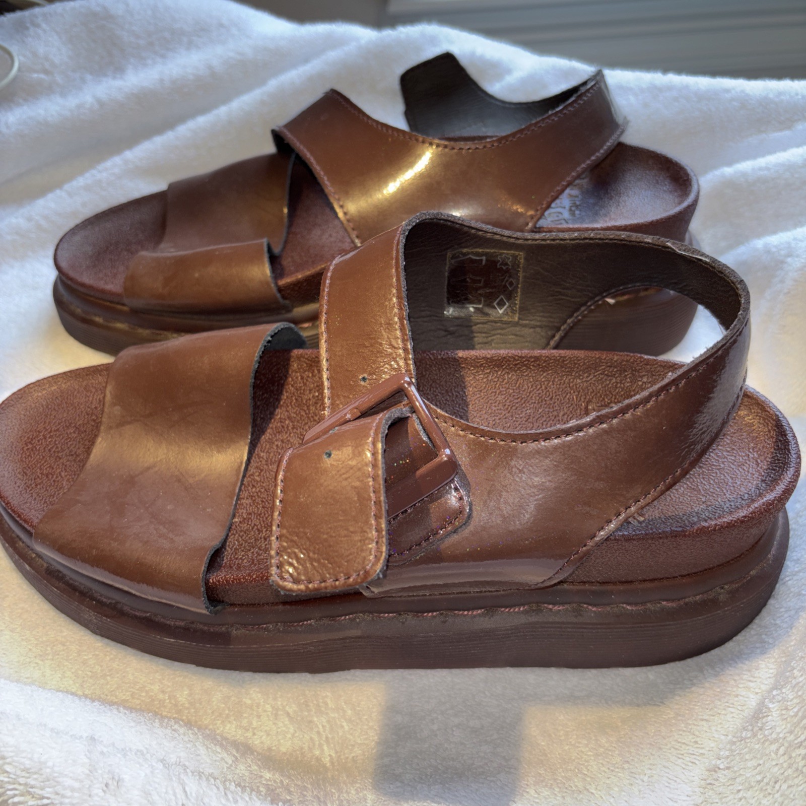 Dr. Martens Romi Y-Strap Sandals in an oxblood/brown patent leather finish