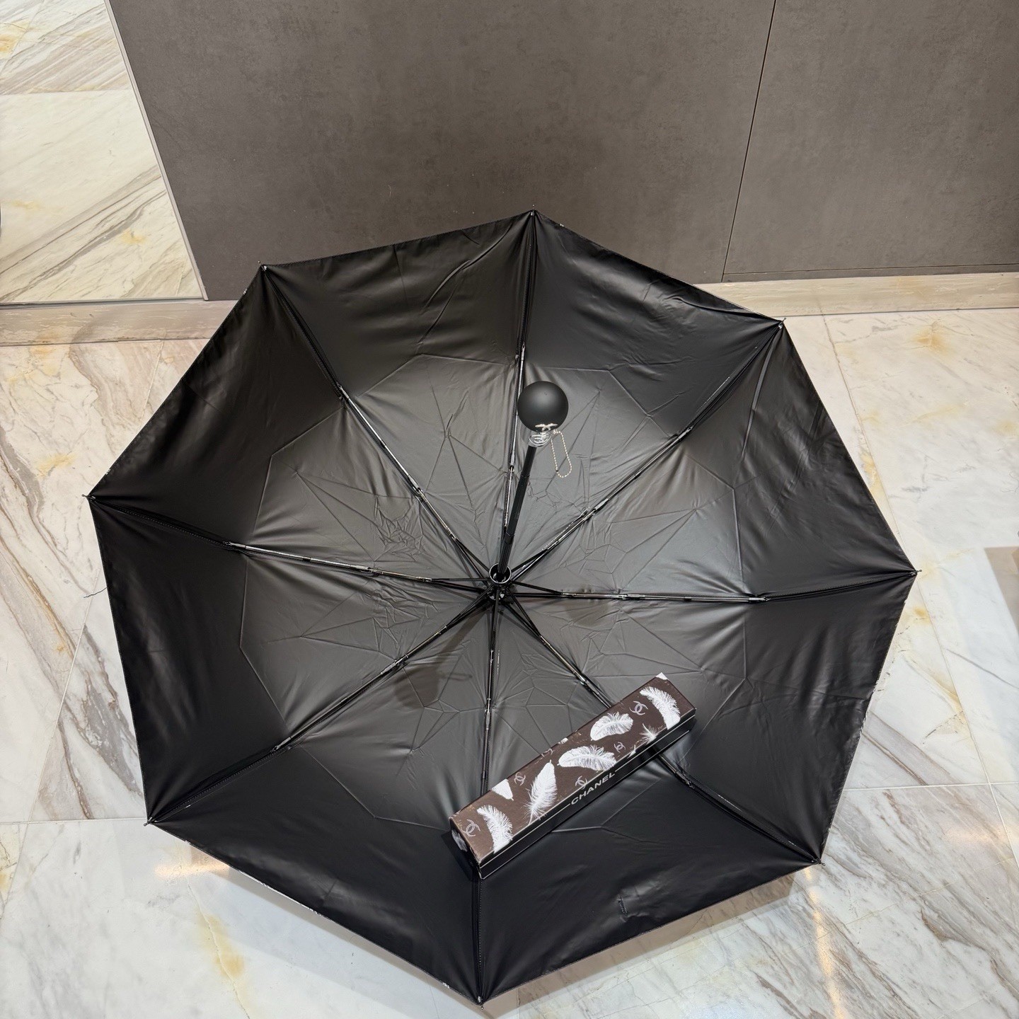 CHANEL Black/White Compact Folding Umbrella Feather Pattern Logo Accent
