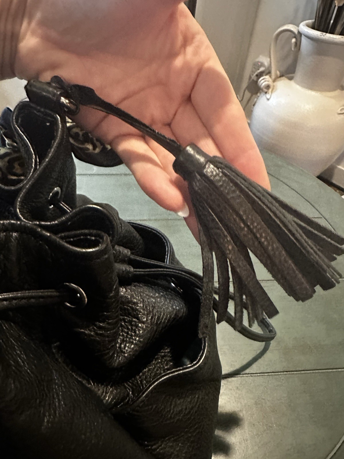 Coach Avery bucket bag. Drawstring closure and silver-tone hardware.