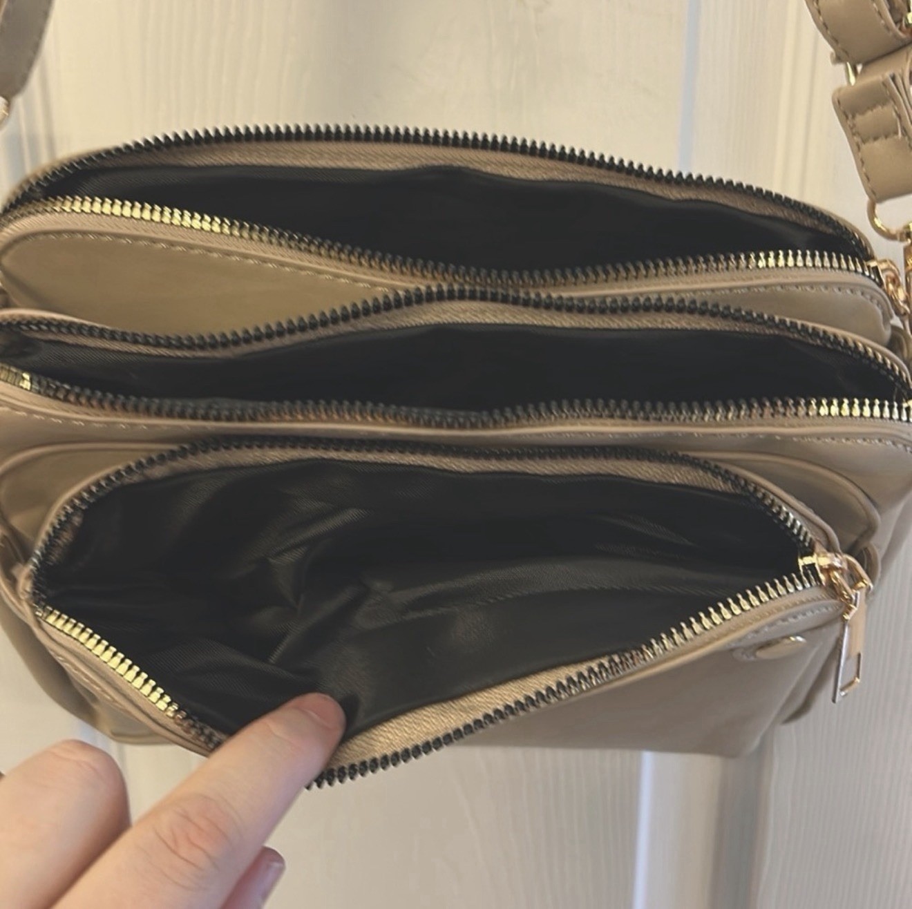beige shoulder bag gold hardware zip magnetic adjustable strap pockets