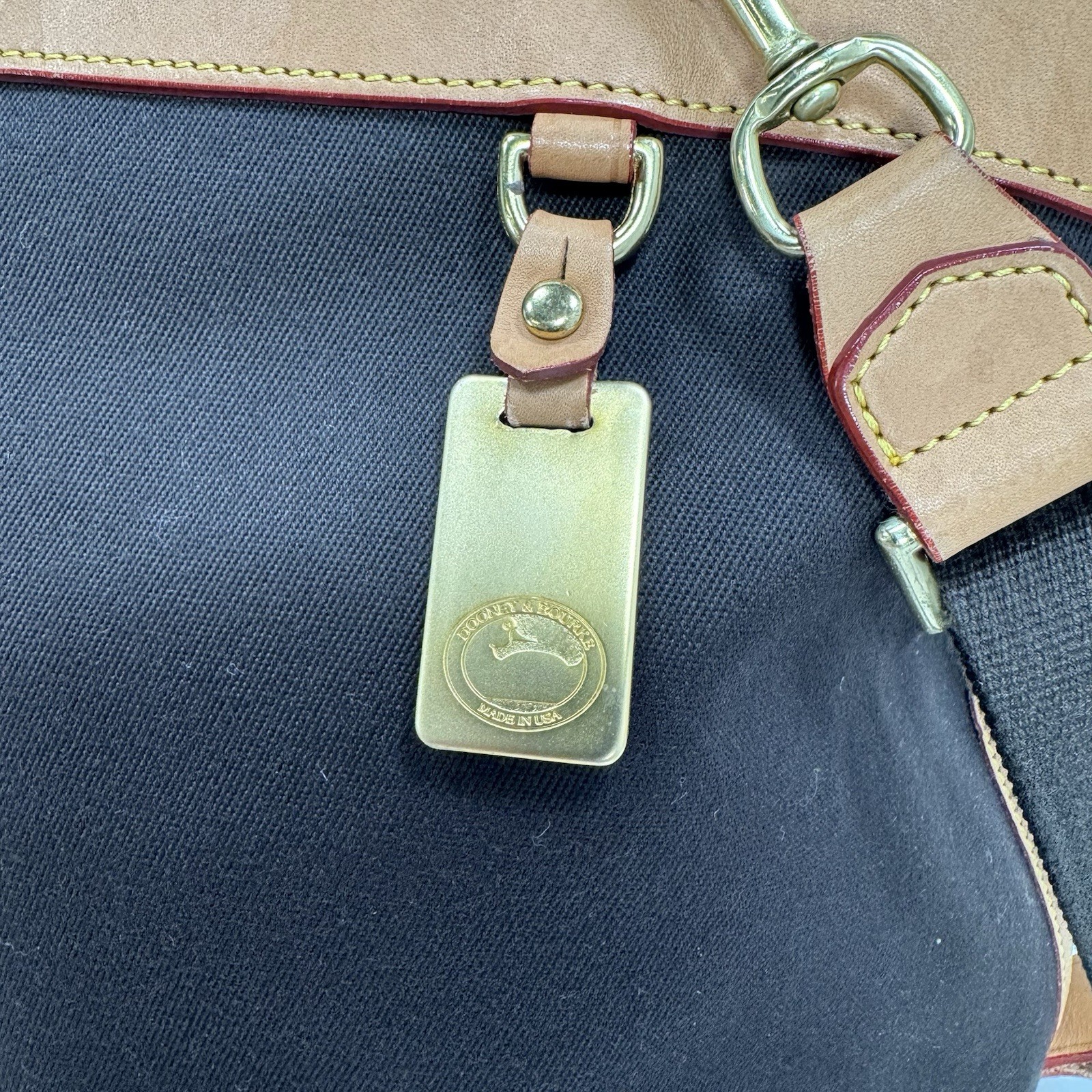 Dooney & Bourke Tan and Black Cabriolet Overnight Travel Bag – See Details