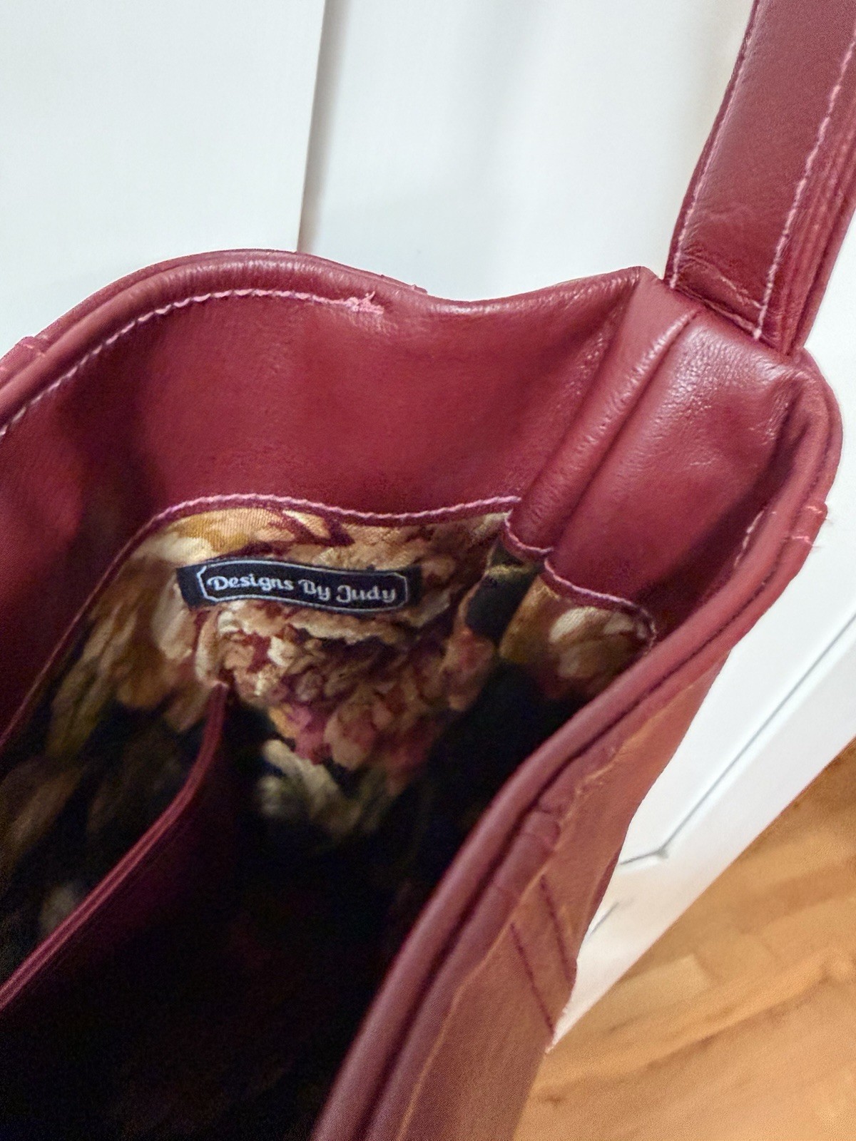 Designs by Judy Burgandy handbag new without tags..Floral tapestry lining