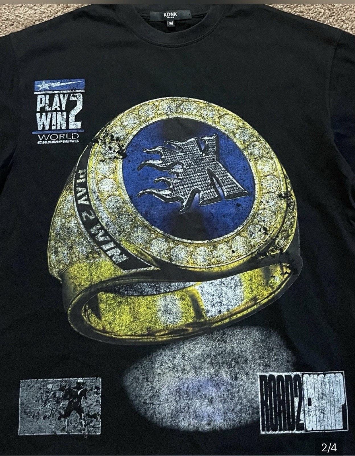 KDNK Black Graphic Tee with Bold Yellow & Blue Ring Design