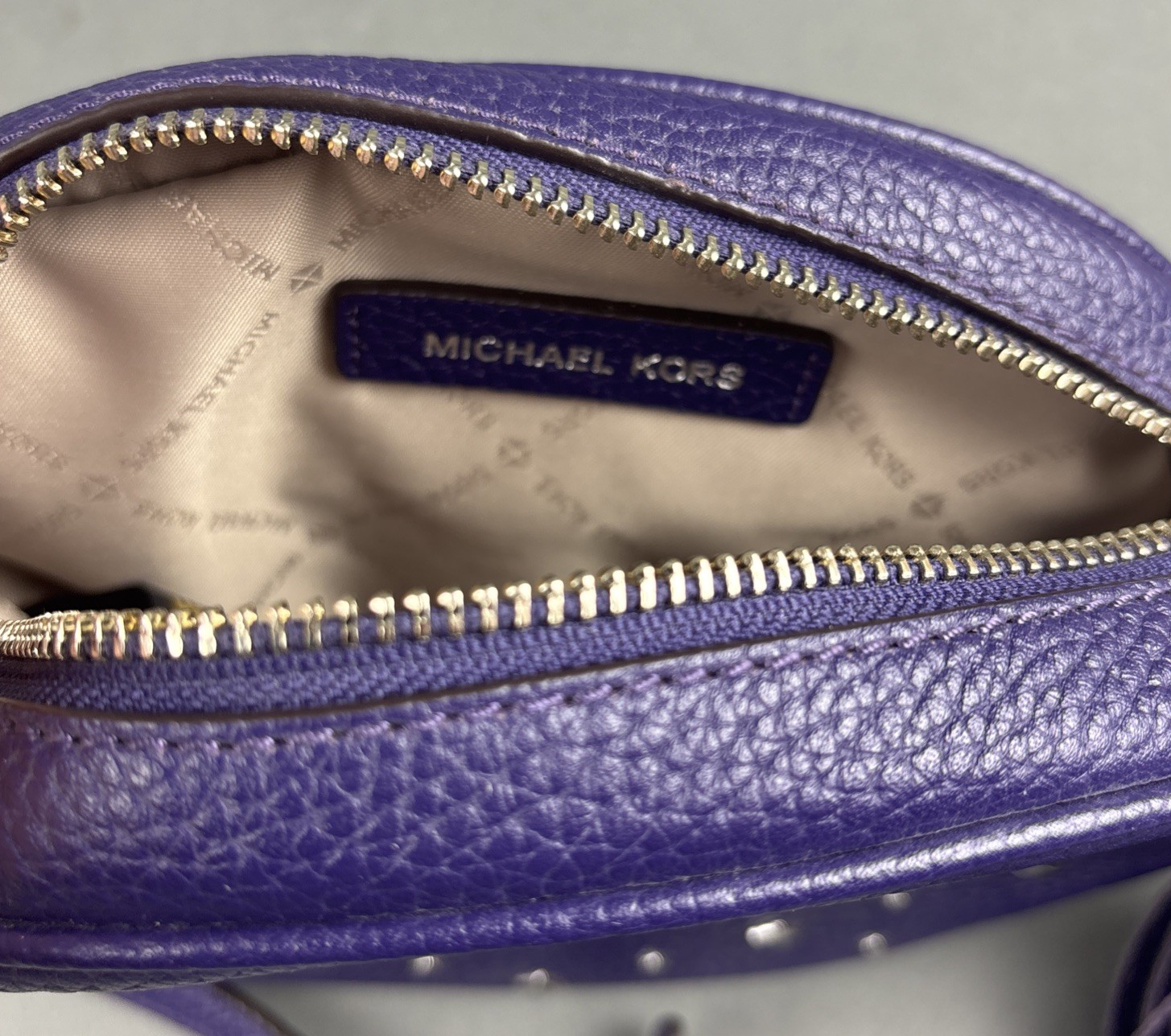 Michael Kors Purple Pebbled Leather Small Oval 7.75″x5.5″ Crossbody Bag w/Tassel