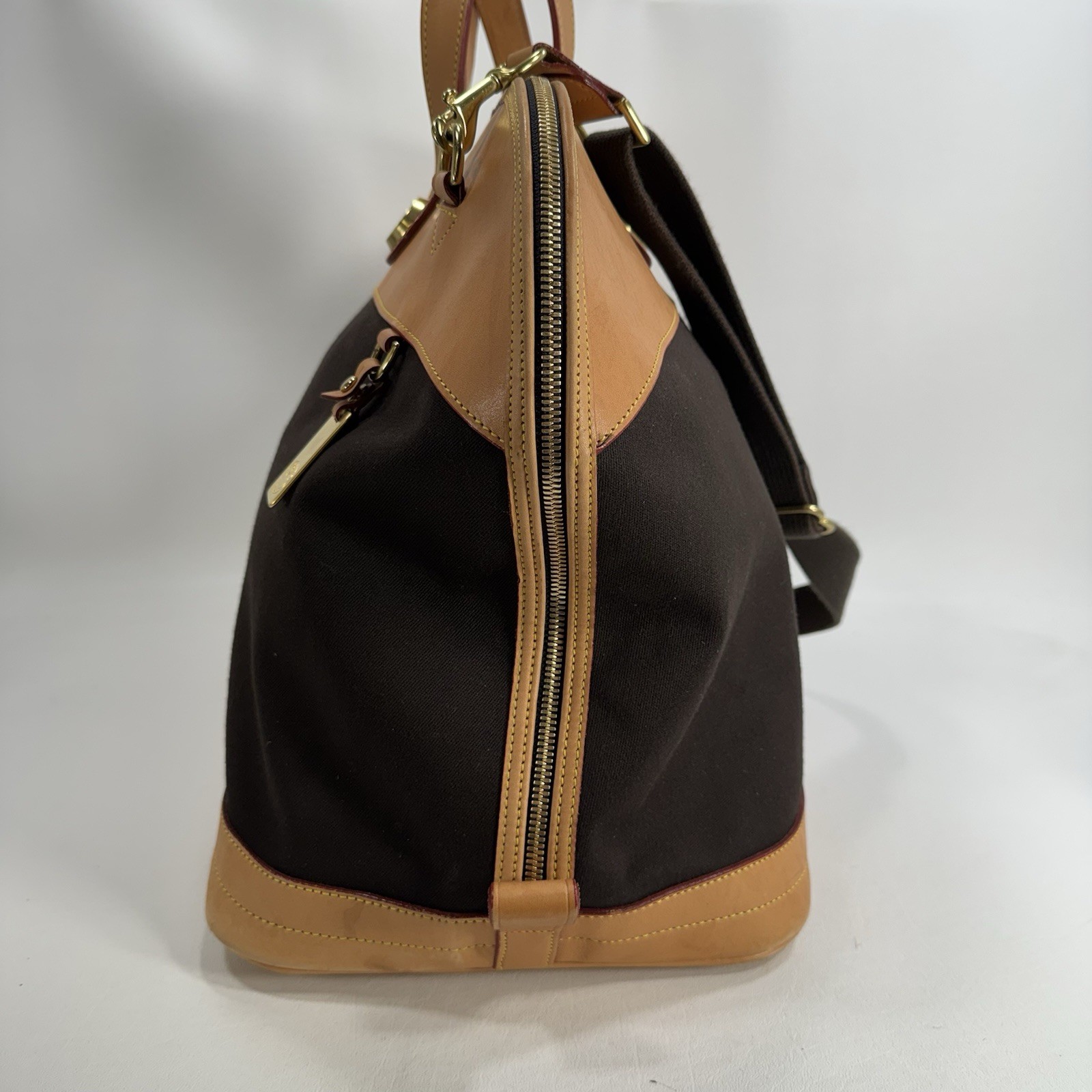 Dooney & Bourke Tan and Black Cabriolet Overnight Travel Bag – See Details