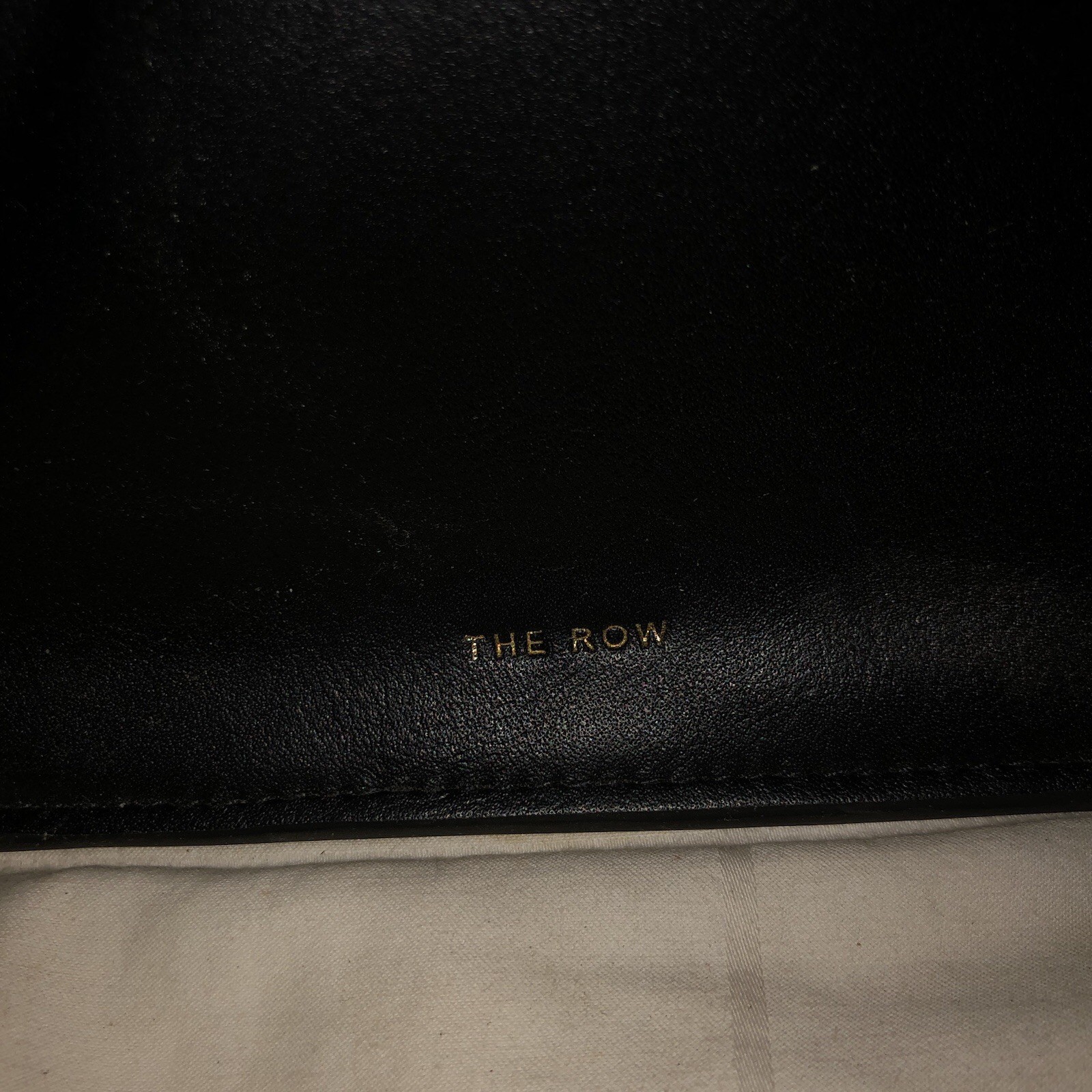 The Row Margaux 15 black with gold hardware
