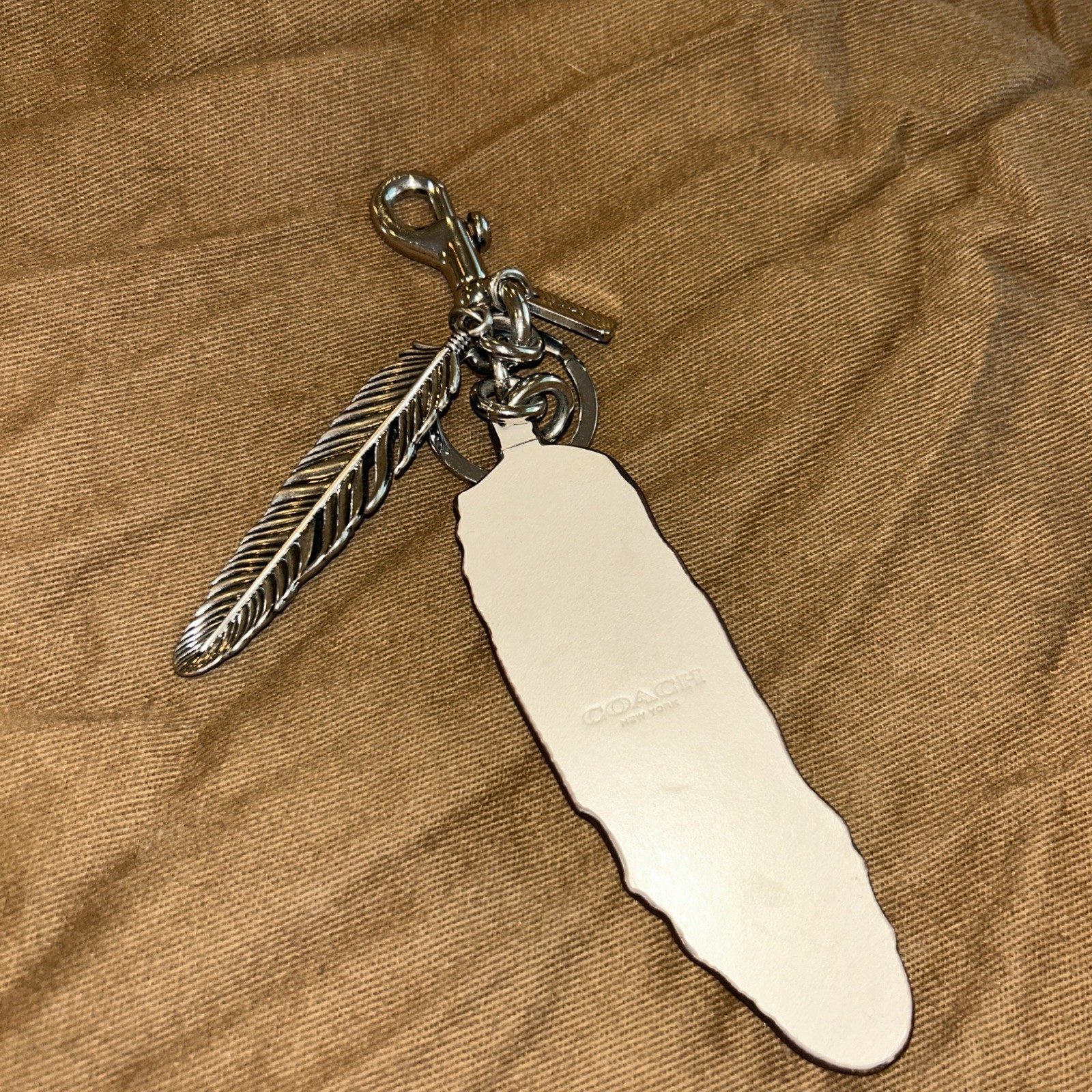 Coach Rare Turquoise and Silver Feather Hang Tag. Excellent Condition